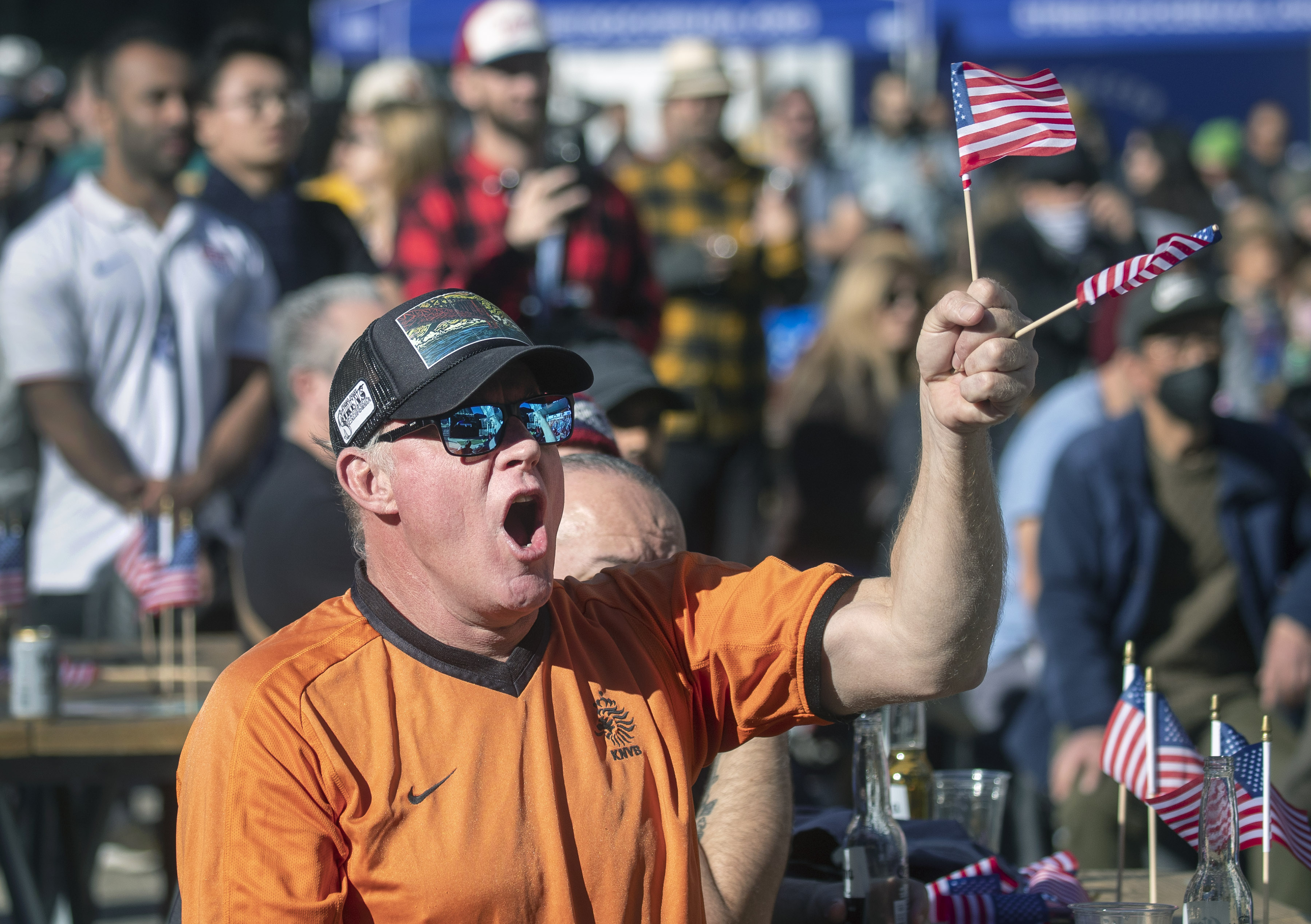 Taz Cole cheers on the United States soccer team during their World Cup match with Iran, Tuesday, Nov. 29, 2022, during an outdoor watch party at The Crossing at East Cut in San Francisco, Calif. (Karl Mondon/Bay Area News Group)