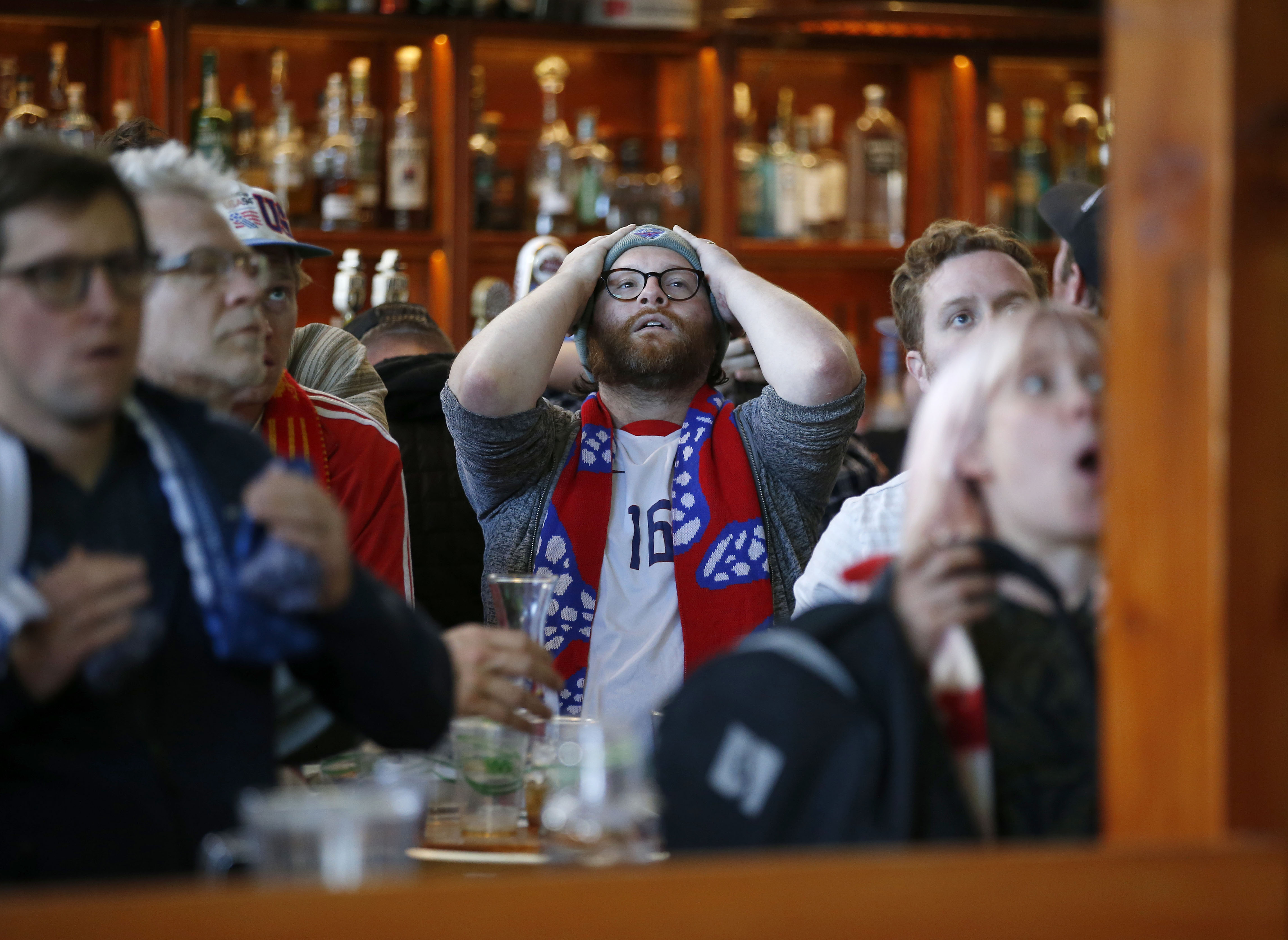 Tyler Crosby-Jolliffe, of Oakland, center, reacts while watching the United States men's national team's match against Iran during a World Cup watch party at The Athletic Club Oakland in downtown Oakland, Calif., on Tuesday, Nov. 29, 2022. The U.S. beat Iran 1-0. (Jane Tyska/Bay Area News Group)