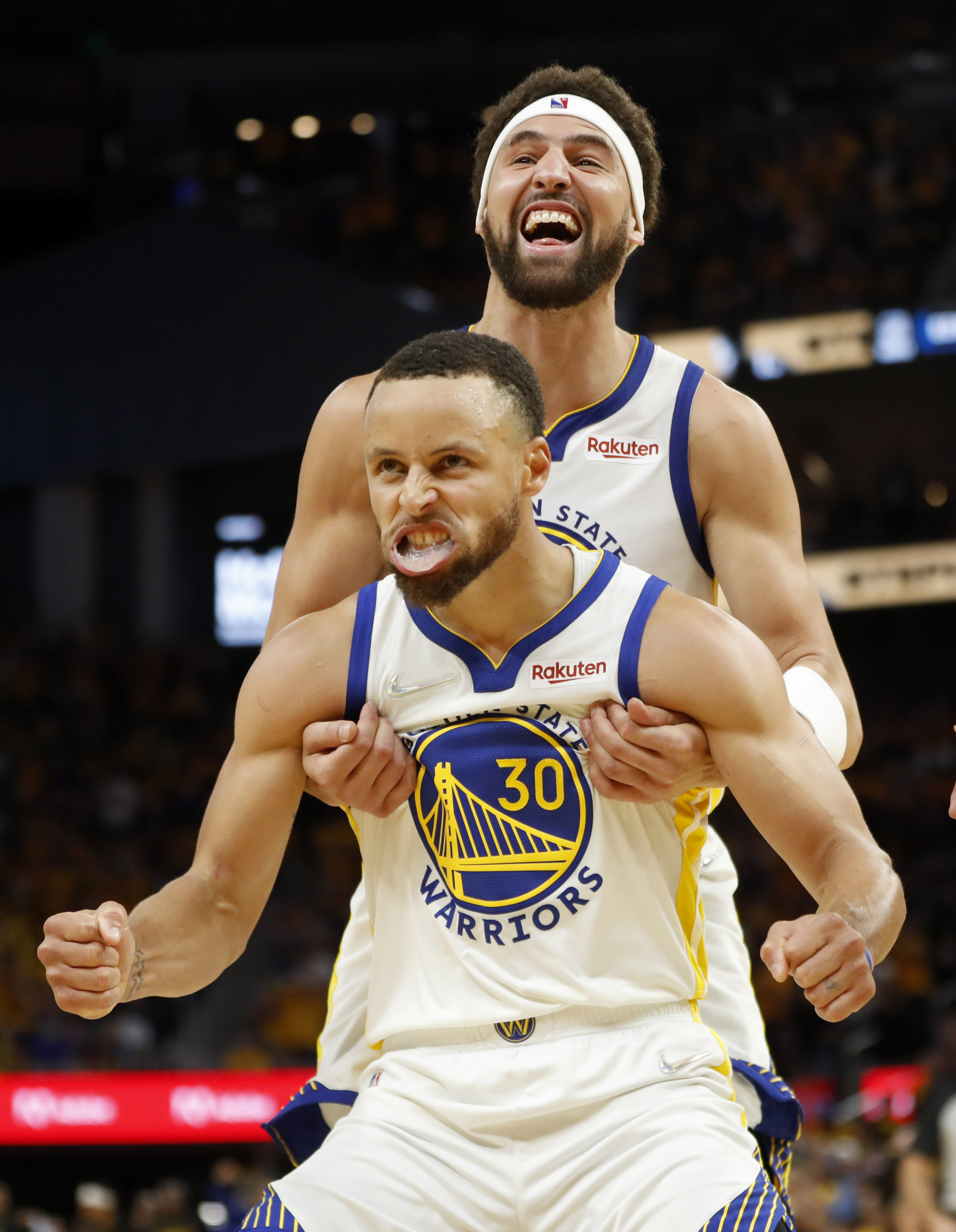 Golden State Warriors' Klay Thompson and Stephen Curry (30) celebrate the final moments of their fourth quarter comeback victory over the Dallas Mavericks in Game 2 of their NBA Western Conference Finals playoffs at Chase Center in San Francisco on May 20. (Karl Mondon/Staff Photographer)