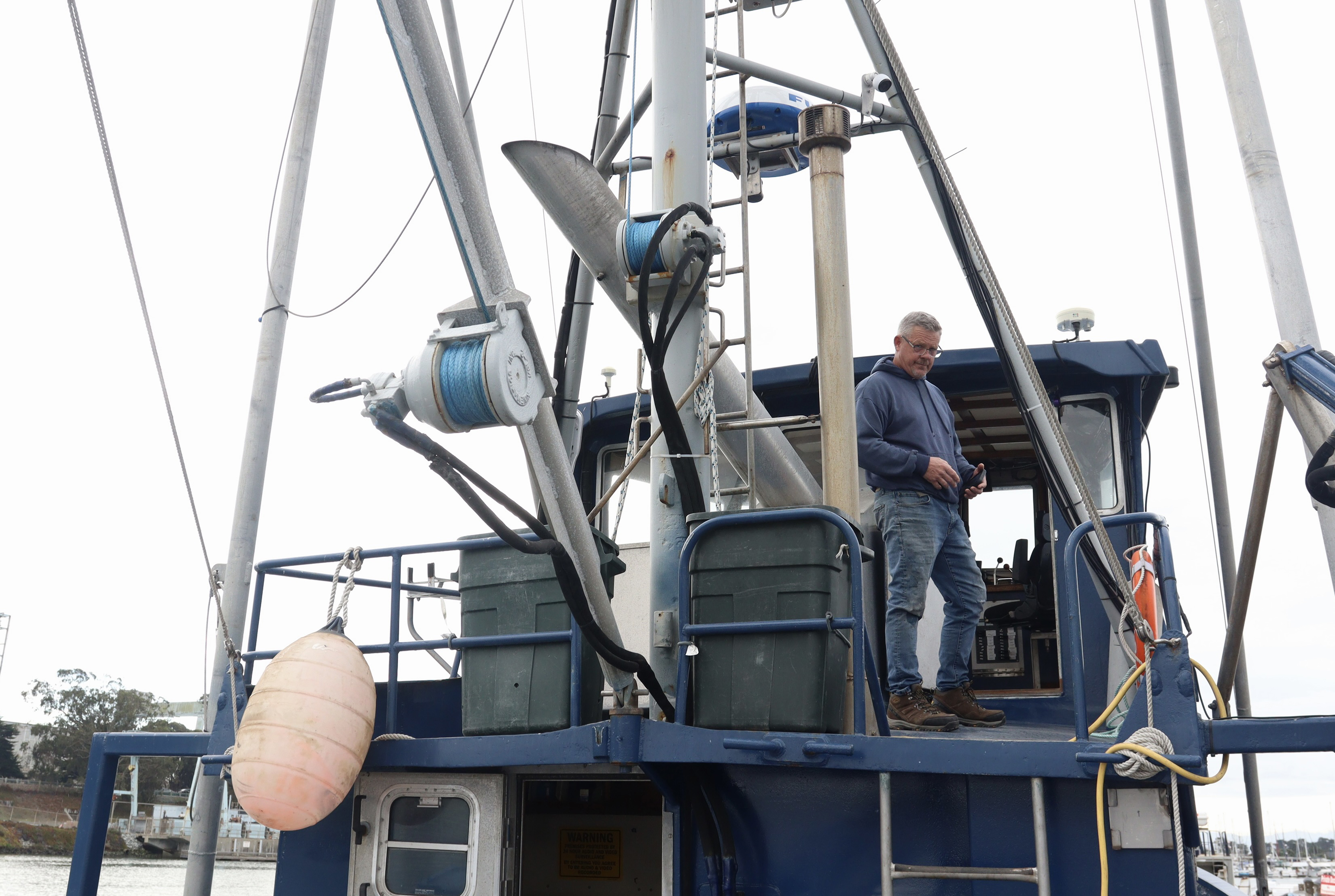 Steve Melz on his fishing boat, the Jacqueline L, docked in Moss Landing on Oct. 31, 2022. 