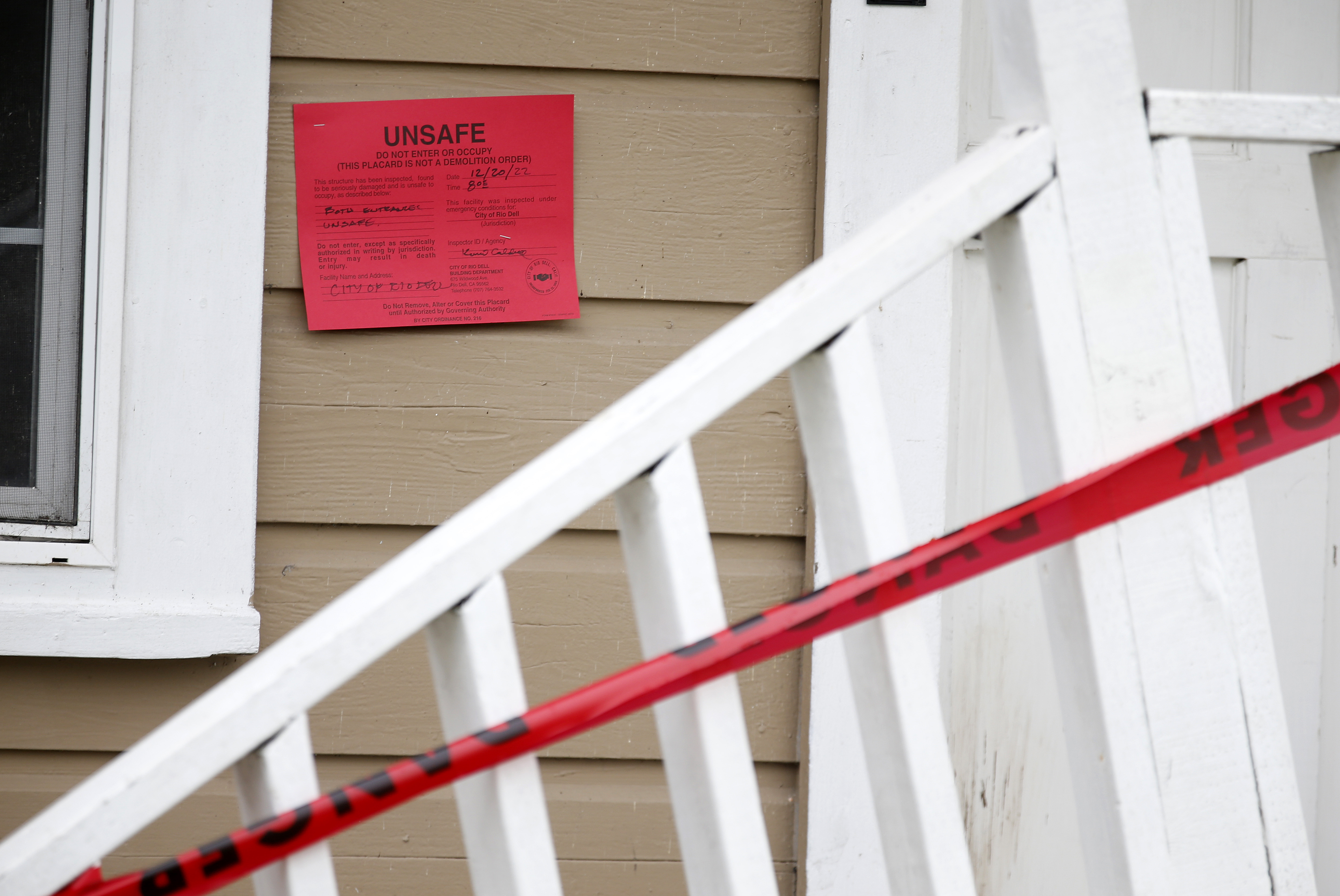 Earthquake damage and a red-tag warning sign are seen at Jacqui McIntosh's house on Painter Street in Rio Dell, Calif., on Tuesday, Dec. 20, 2022.