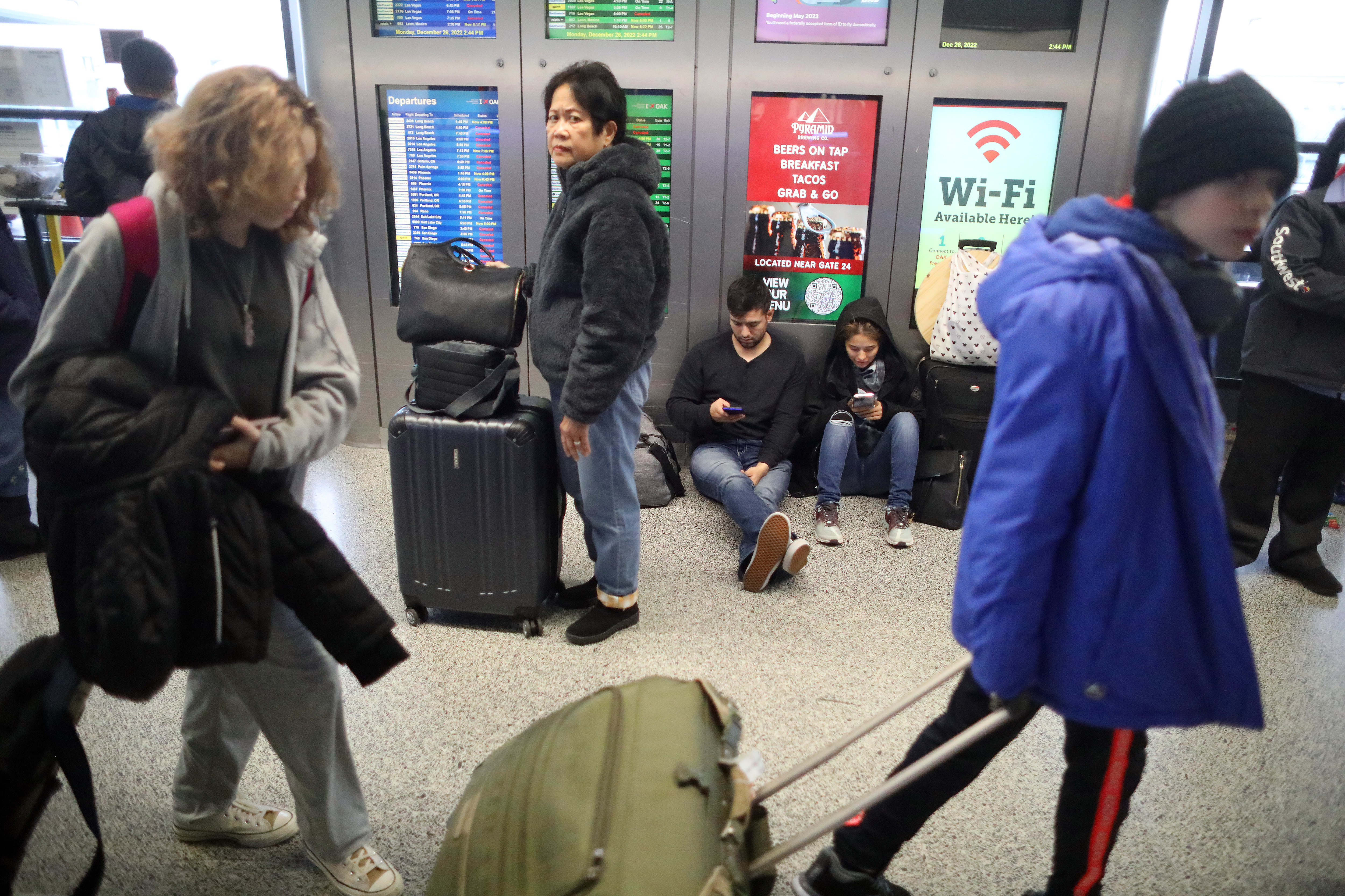 Travelers in Terminal 1 of the Oakland International Airport on Monday, Dec. 26, 2022, in Oakland, Calif (Aric Crabb/Bay Area News Group)