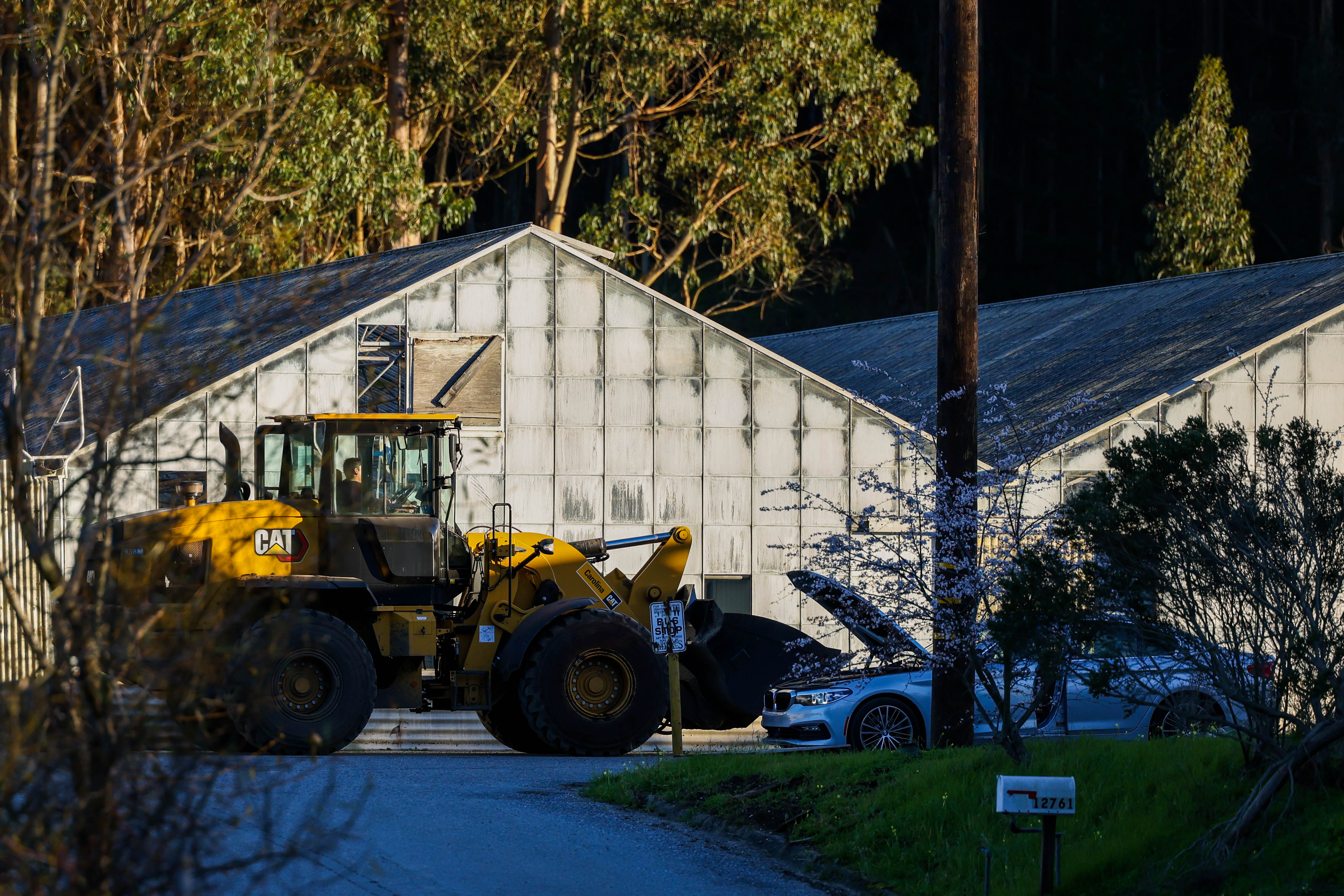 A bulldozer rides along the California Terra Gardens farm in Half Moon Bay, Calif., on Thursday, Jan. 26, 2023. Chunli Zhao, 66, who allegedly lived and worked there, has been charged with seven counts of murder and one count of attempted murder for the mass shooting on Monday. (Ray Chavez/Bay Area News Group)