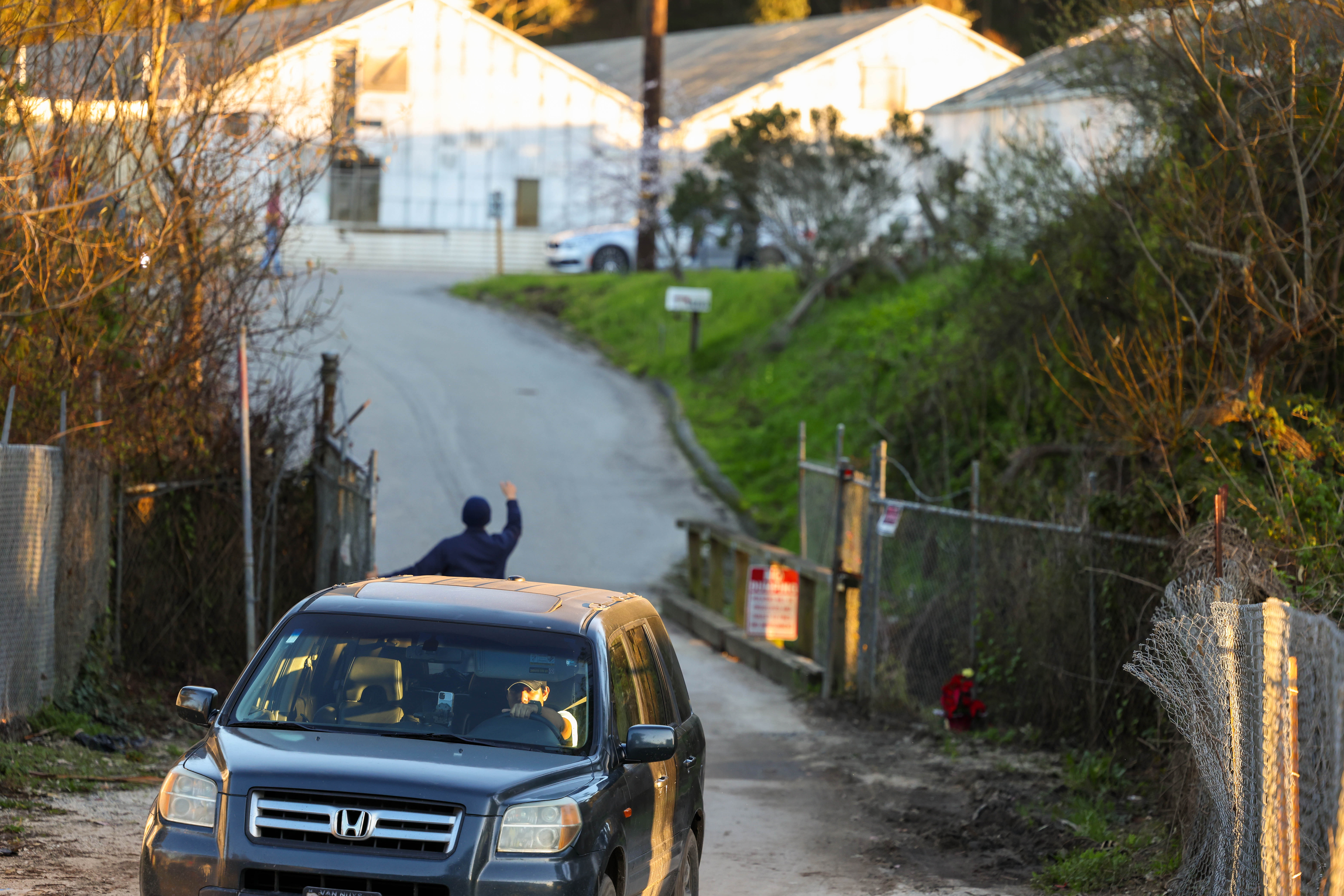 A vehicle exits the California Terra Gardens farm in Half Moon Bay, Calif., on Thursday, Jan. 26, 2023. Chunli Zhao, 66, who allegedly lived and worked there, has been charged with seven counts of murder and one count of attempted murder for the mass shooting on Monday. (Ray Chavez/Bay Area News Group)