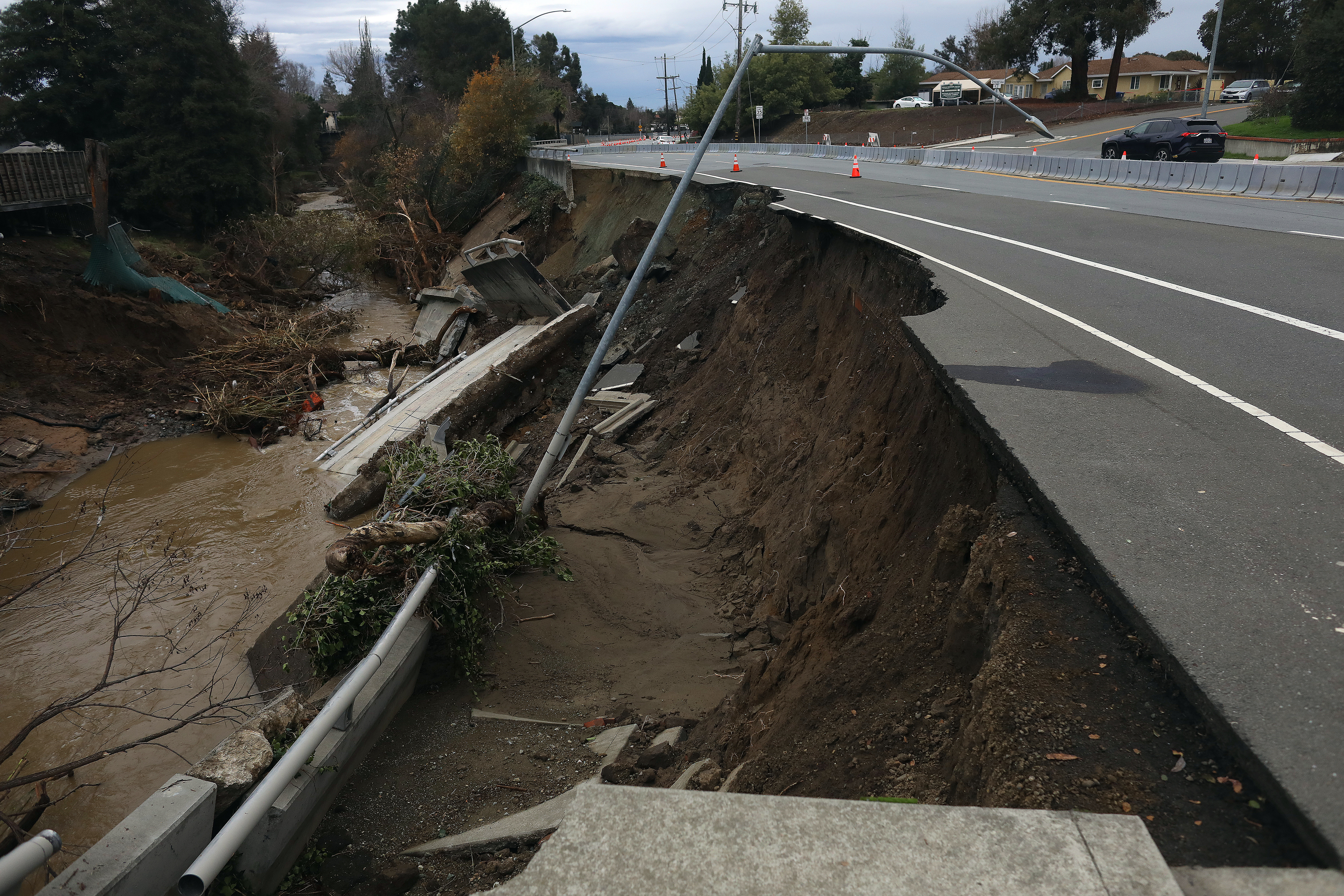 A section of A Street near Crescent Avenue is closed after washing into San Lorenzo Creek on Monday, Jan. 2, 2023, in Castro Valley, Calif. (Aric Crabb/Bay Area News Group)