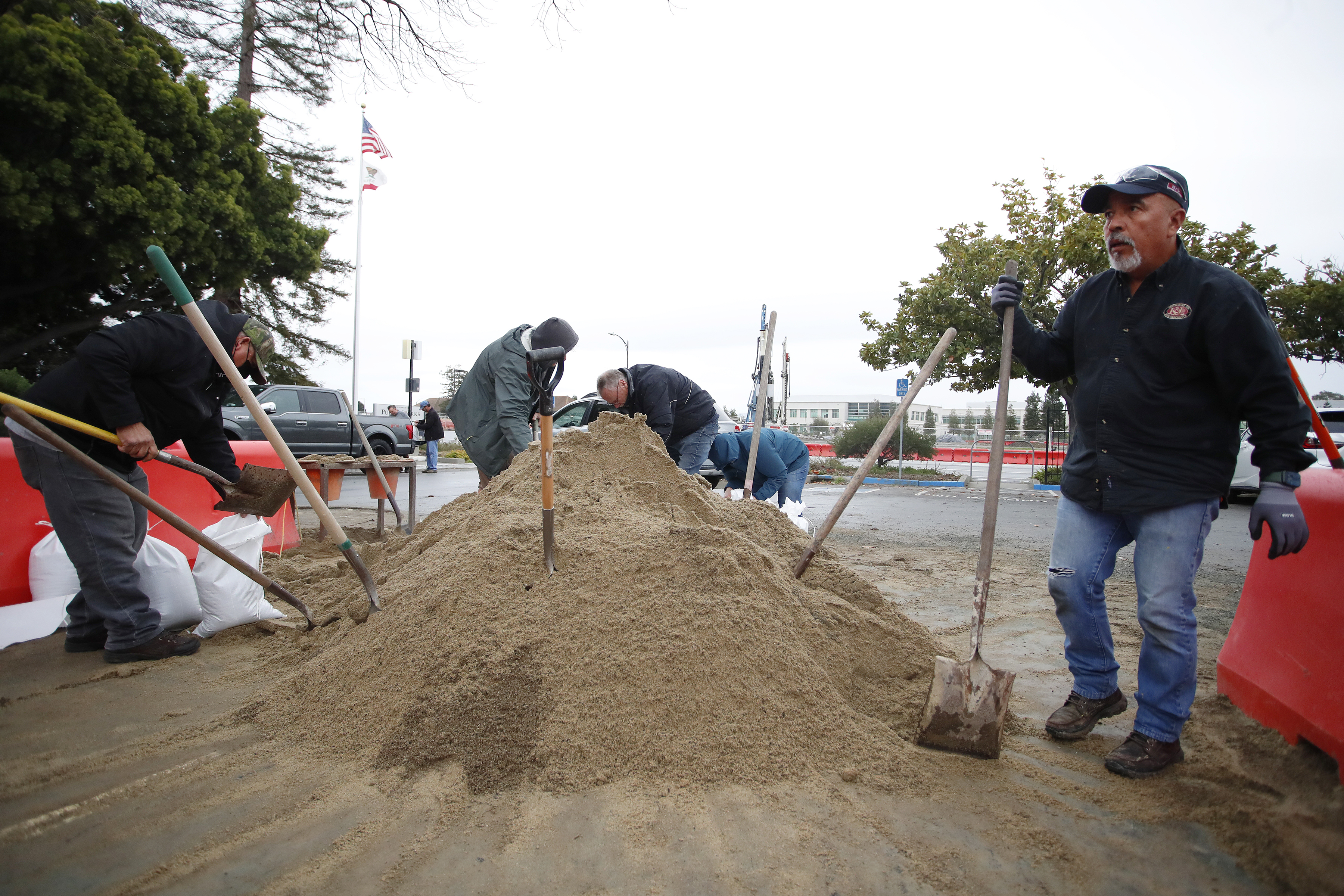 Jorge Valencia, right, waits for sandbags at the City of Redwood City Public Works Services yard in Redwood City, Calif., on Monday, Jan. 2, 2023. (Josie Lepe for Bay Area News Group)