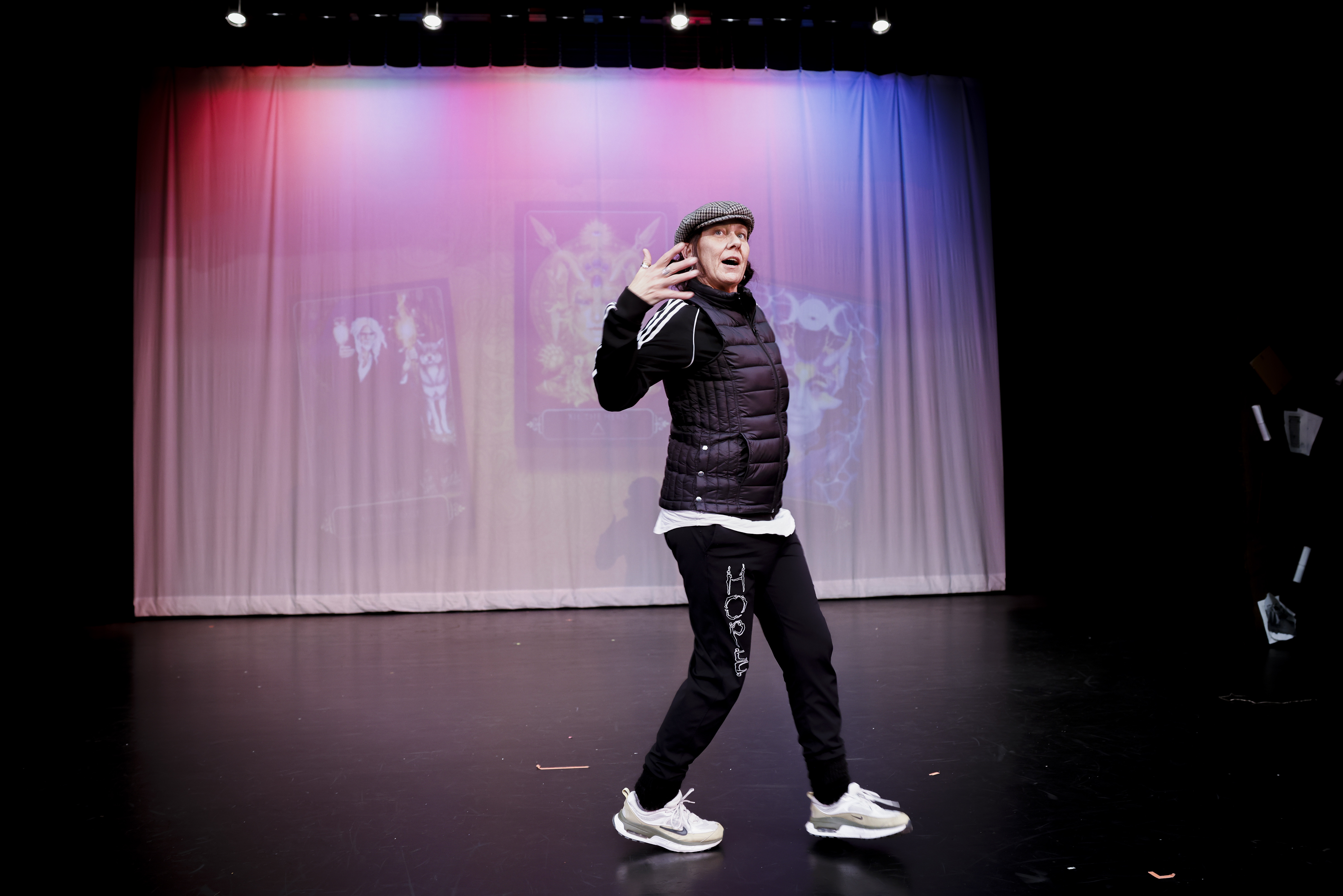 Kim Agnew, a traveling music and art teacher from Oakland, shows students dance moves during a dress rehearsal for a play at Jefferson High School in Daly City, Calif., on Tuesday, Feb. 7, 2023. 