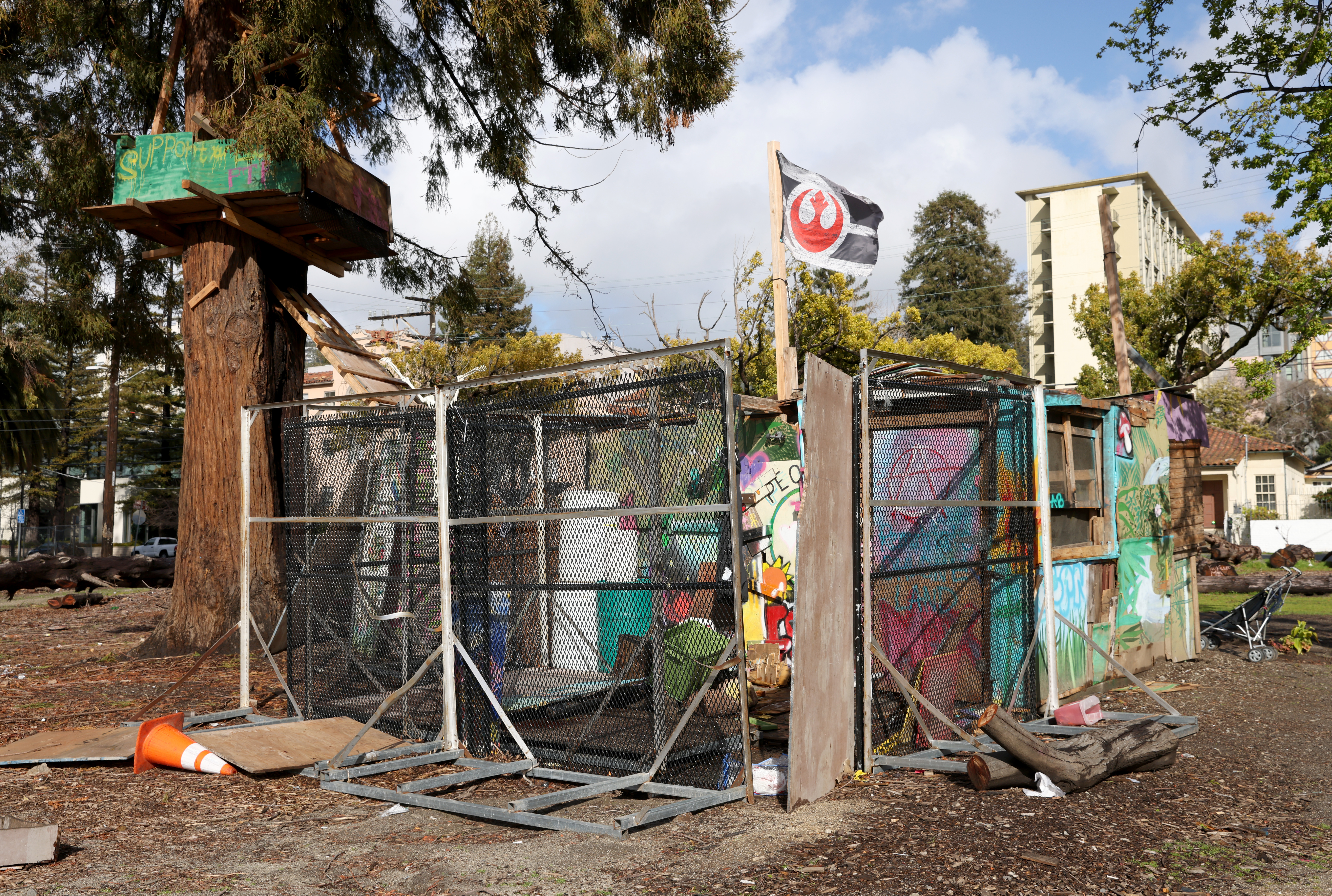 A makeshift structure and treehouse on one of the last remaining trees at People's Park in Berkeley, Calif., on Monday, Feb. 27, 2023. A California appeals court has blocked a proposed housing project at the park that has drawn protest and controversy, ruling that the project's Environmental Impact Report was inadequate.