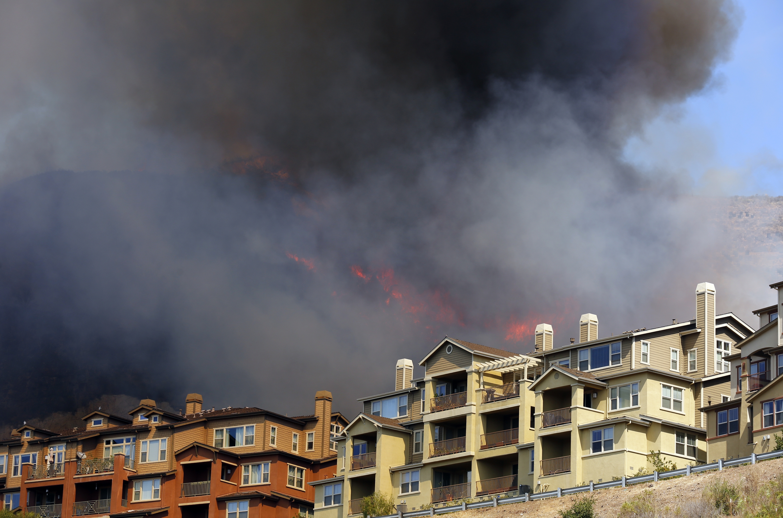 Oakland fire crews and Cal Fire fight a 20-acre fire in the Leona Quarry, forcing the evacuation of about 100 homes in the area on Tuesday, Sept. 26, 2017 in Oakland, Calif.