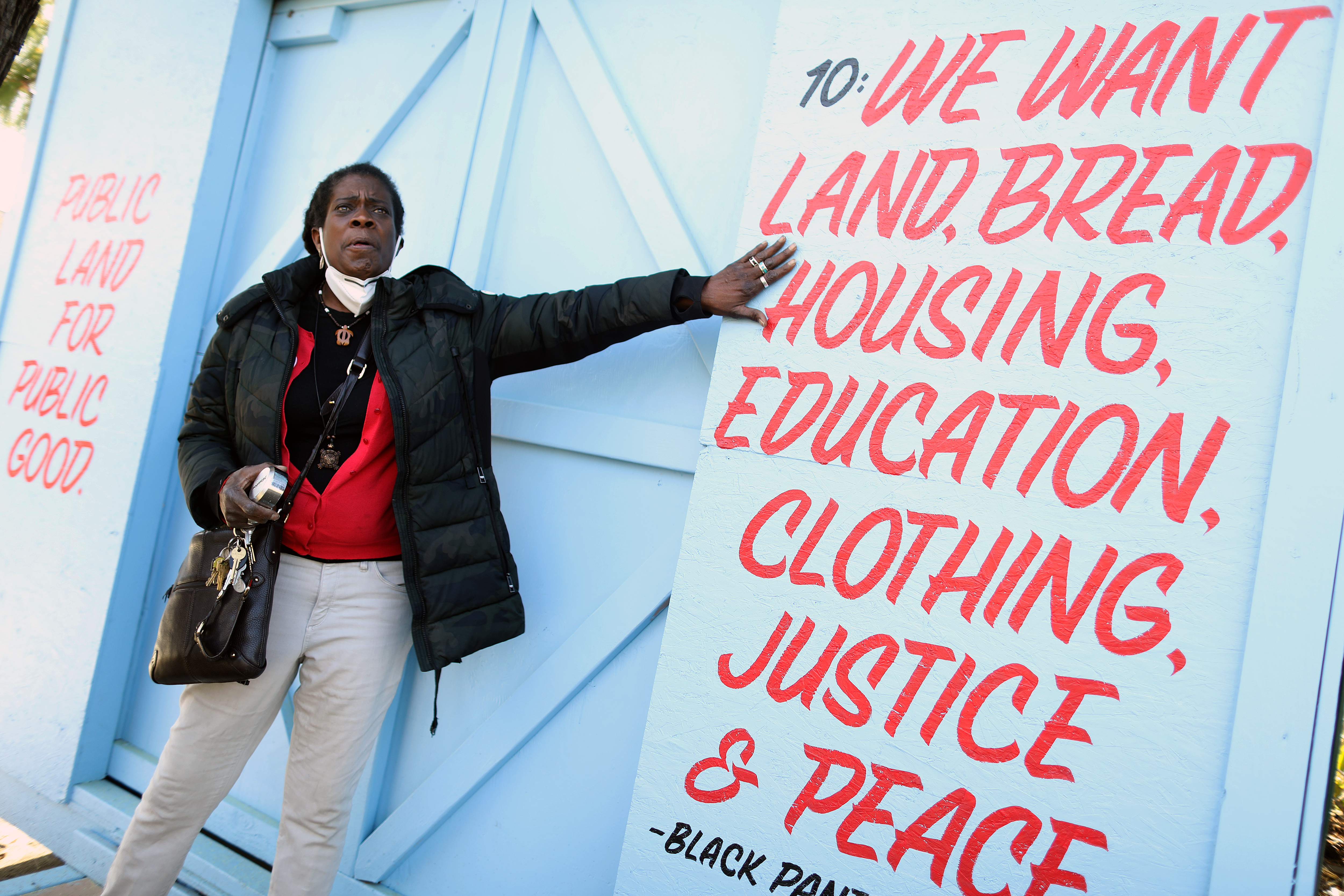 Frances Moore with artwork at Driver Plaza on Wednesday, March 15, 2023, in Oakland, Calif.