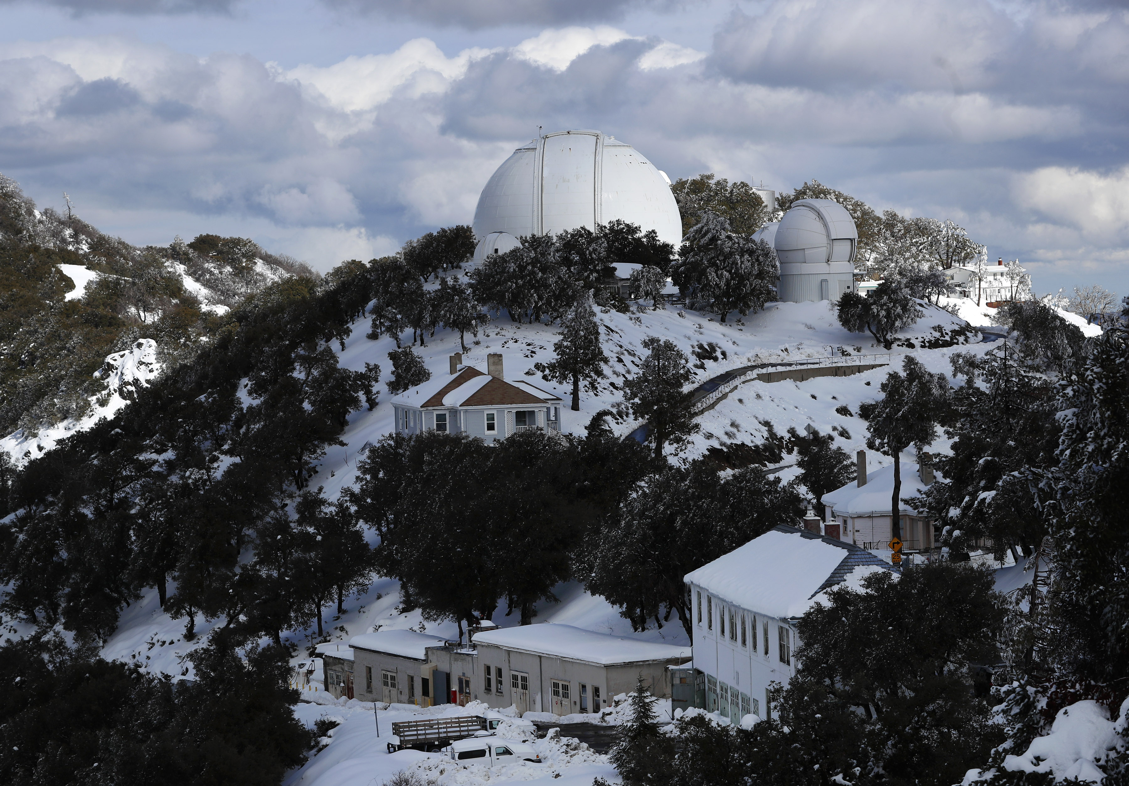Snow covers Lick Observatory where the Shane telescope, the facility's largest, catches a ray of sunshine, Tuesday, March 7, 2023.