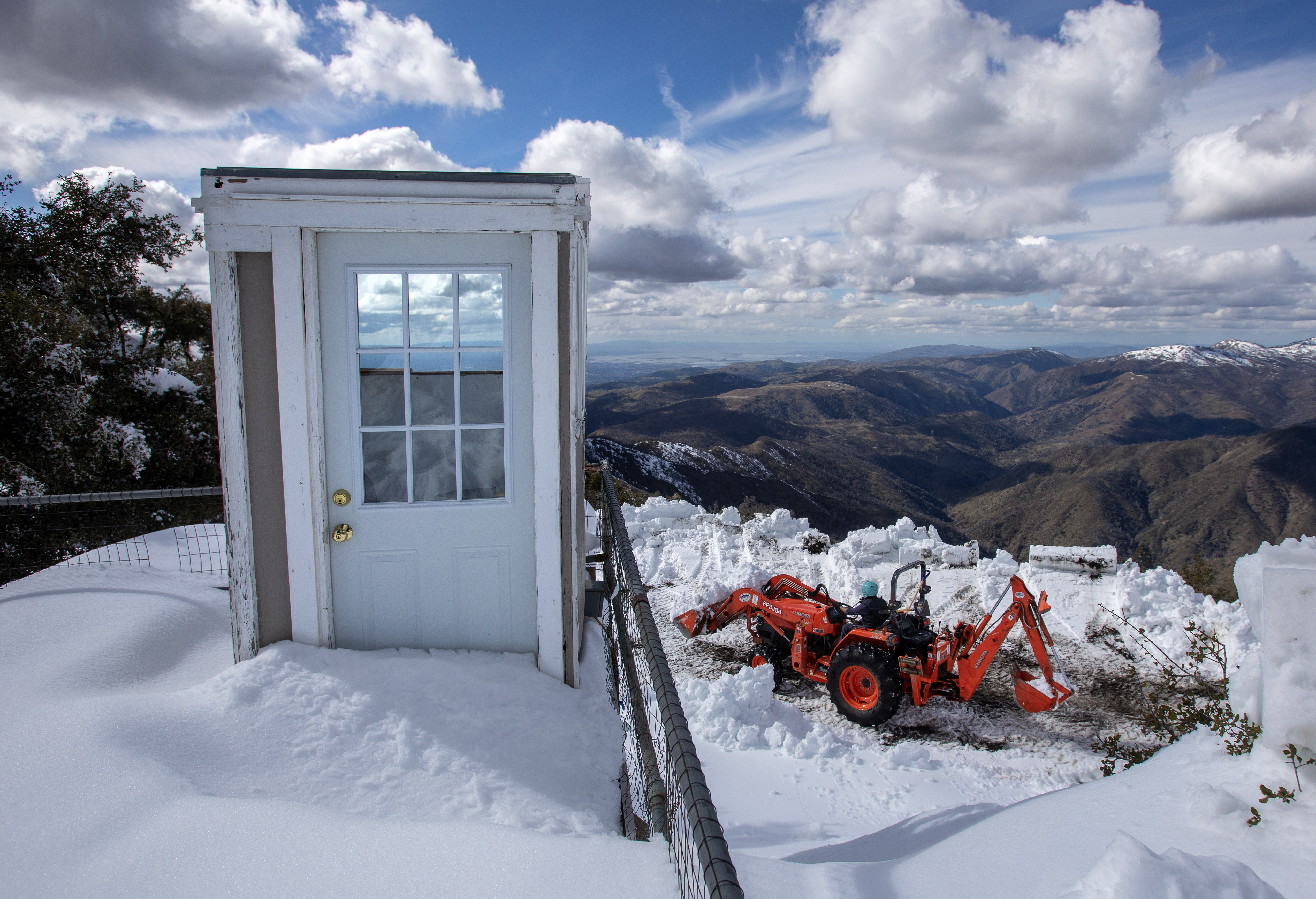 Rocky Franciso clears snow below an observation shack at Lick Observatory's Shane telescope, Tuesday, March 7, 2023.