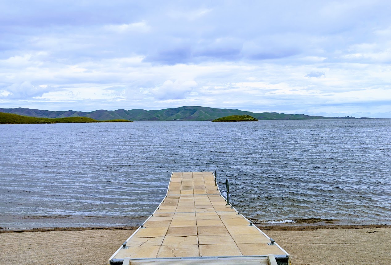 San Luis Reservoir, a key water supply for much of California that is located between Gilroy and Los Banos along Highway 152, is full. The reservoir, shown on Wednesday March 29, 2023, was just 24% full last fall, but relentless winter storms have brought its water level to the top. (Paul Rogers / Bay Area News Group)