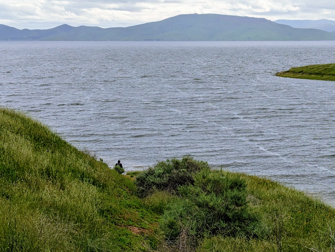 A fisherman heads down to San Luis Reservoir, a key water supply for much of California that is located between Gilroy and Los Banos along Highway 152. The reservoir, shown on Wednesday March 29, 2023, was just 24% full last fall, but relentless winter storms have brought its water level to the top. (Photo: Paul Rogers / Bay Area News Group)