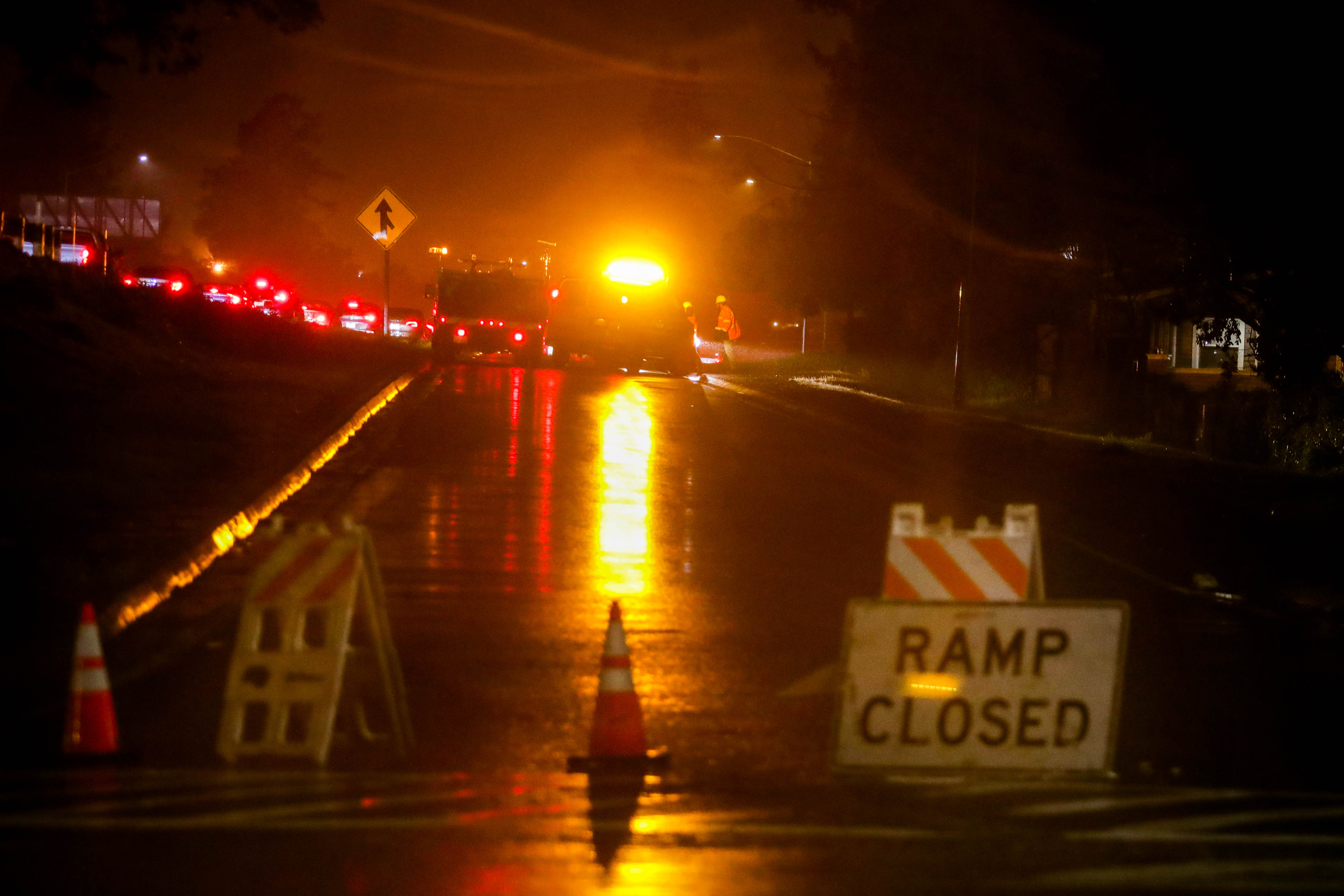 Caltrans close the I-580 westbound ramp at High Street in Oakland, Calif., as traffic is backed up due to flooded lanes near Fruitvale Avenue exit on Thursday, March. 9, 2023. 