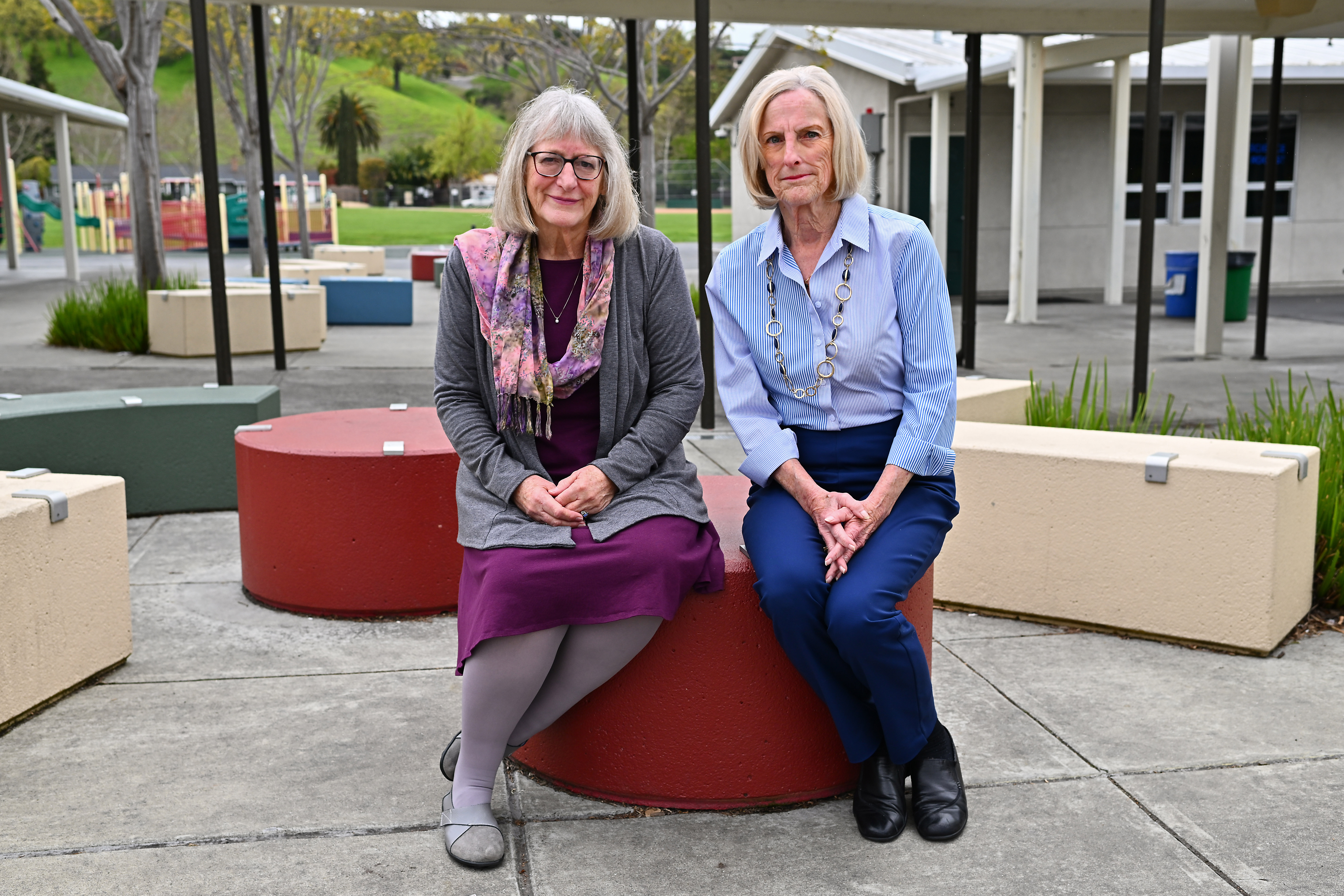 Retired teachers Stephanie Brown-Myers, of Danville, left, and Georgia Moore, of Walnut Creek, are photographed at Green Valley Elementary School in Danville, Calif., on Friday, April 7, 2023.
