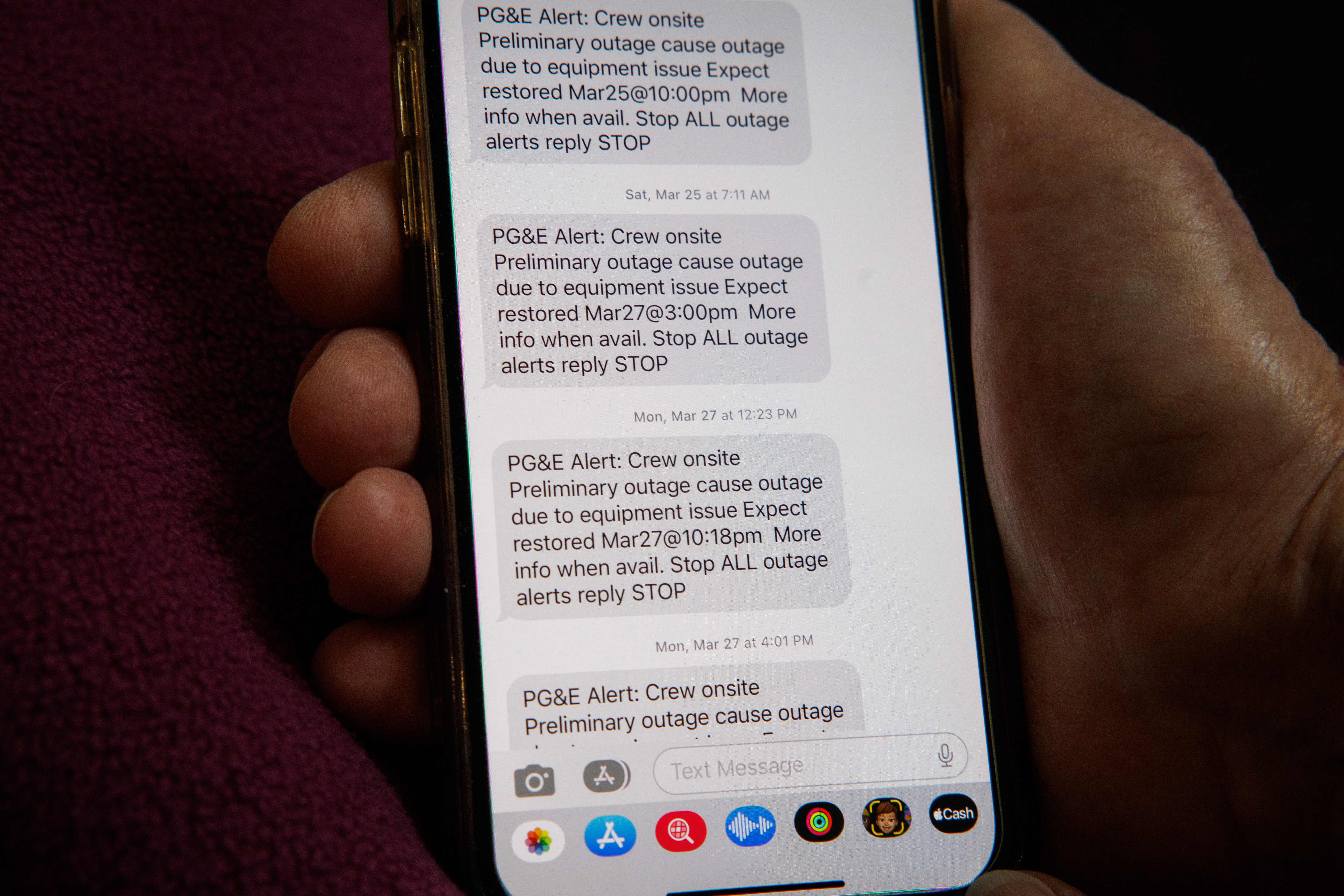 On April 28, 2023, Betty Arnold of Saratoga shows text alerts from PG&E with expected dates for power to come back on during a more than two-week outage in March and April.