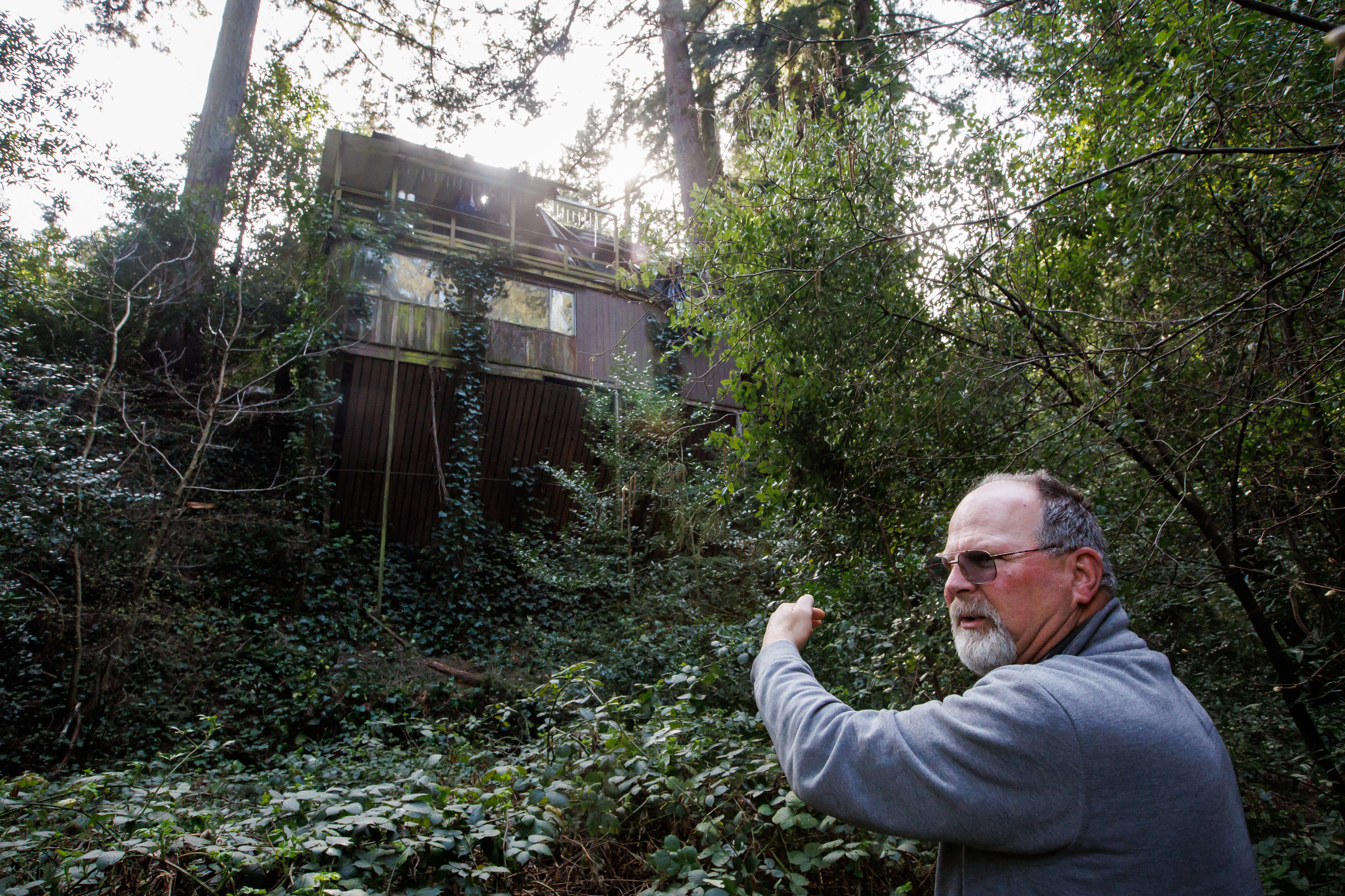 Property owner Bill Kersten, 66, shows some of the storm damage to the hillside house that once belonged to Cora Evans, a Catholic "Servant of God," in Boulder Creek. (Dai Sugano/Bay Area News Group)