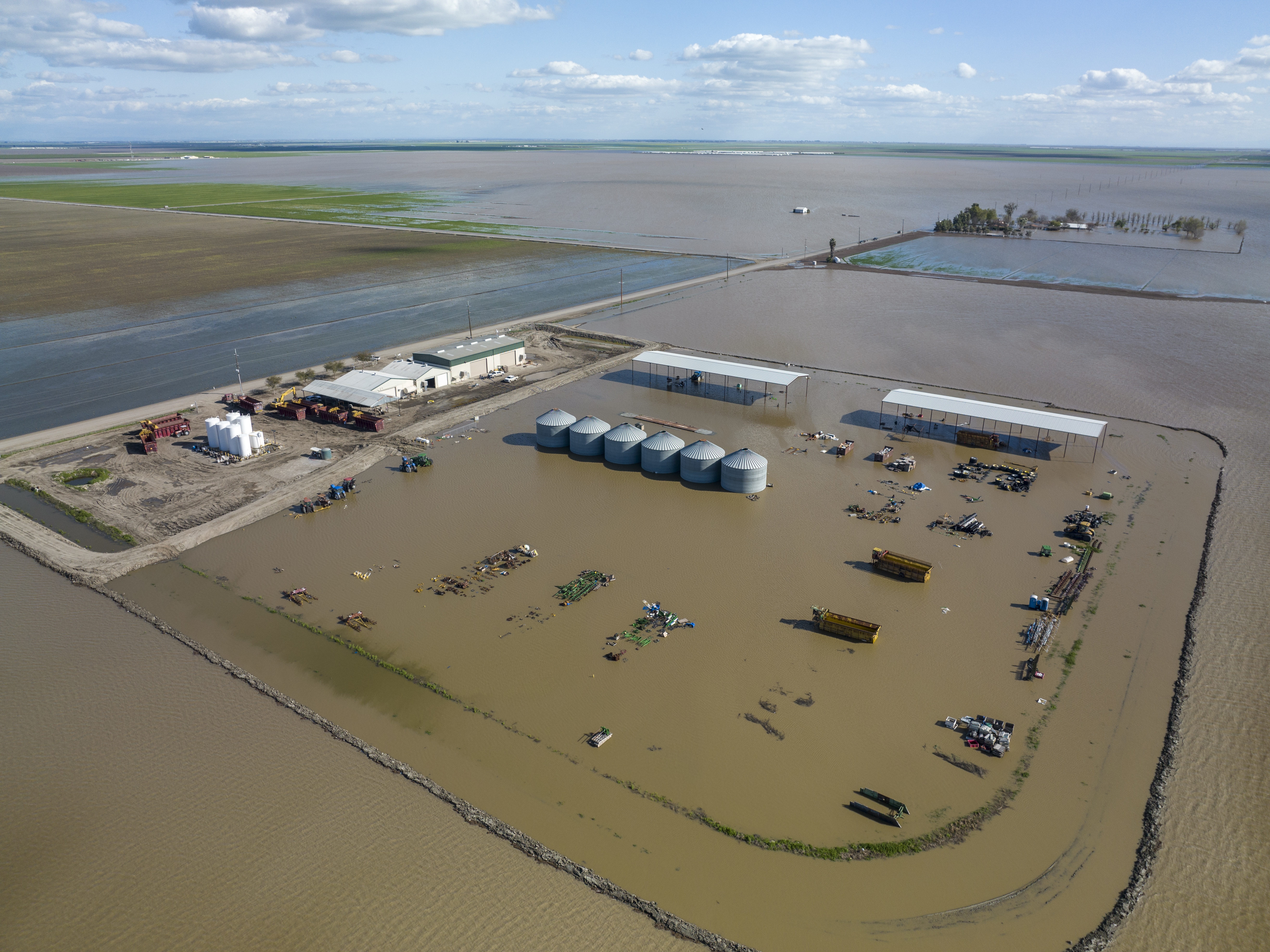 A drone view of flooded fields and properties south of Corcoran in Kings County on March 24, 2023.