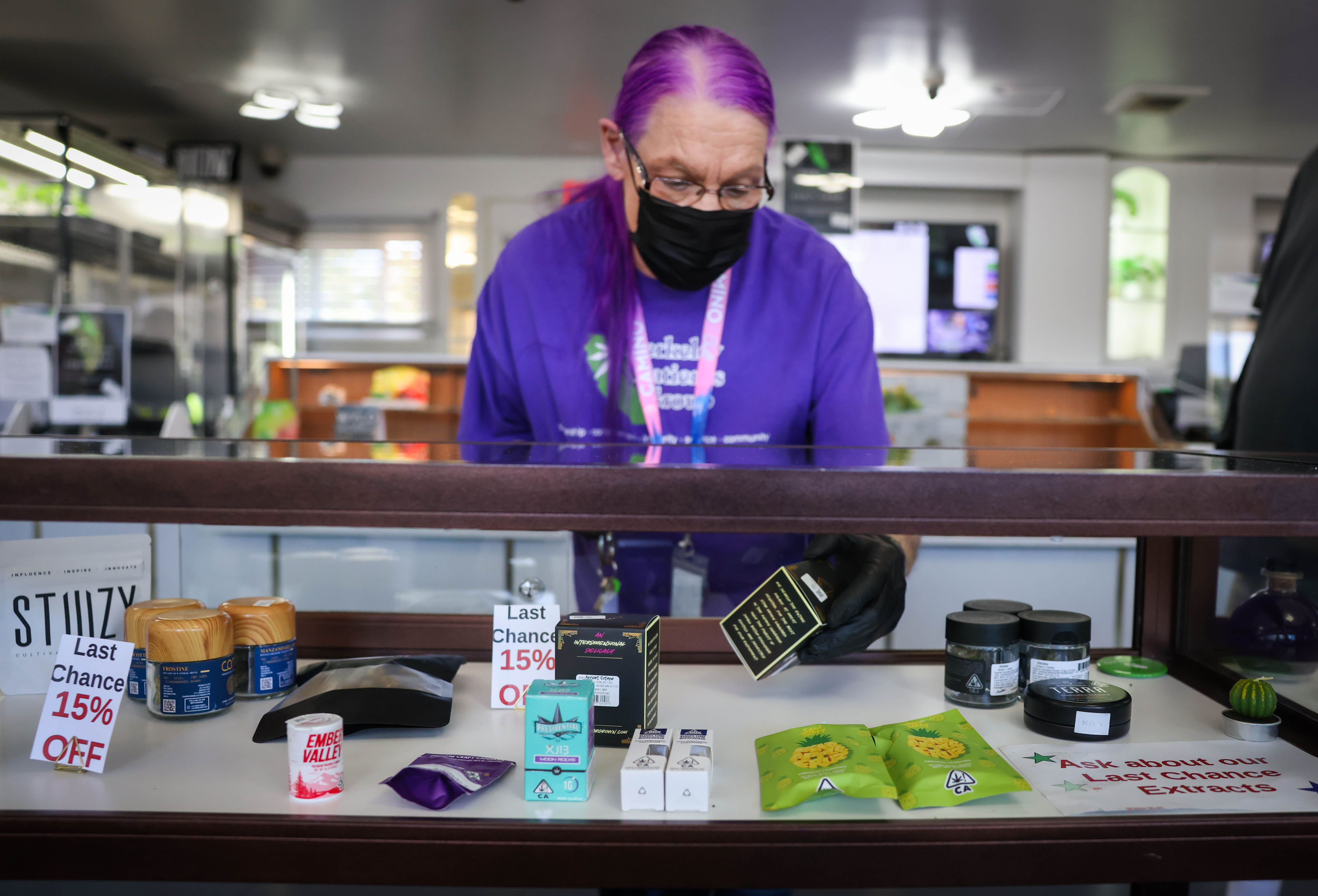 Cannabis dispensary employee Sue Gardea grabs a product for a customer at the Berkeley Patients Group in Berkeley, Calif., on Tuesday, May 24, 2023. (Ray Chavez/Bay Area News Group)