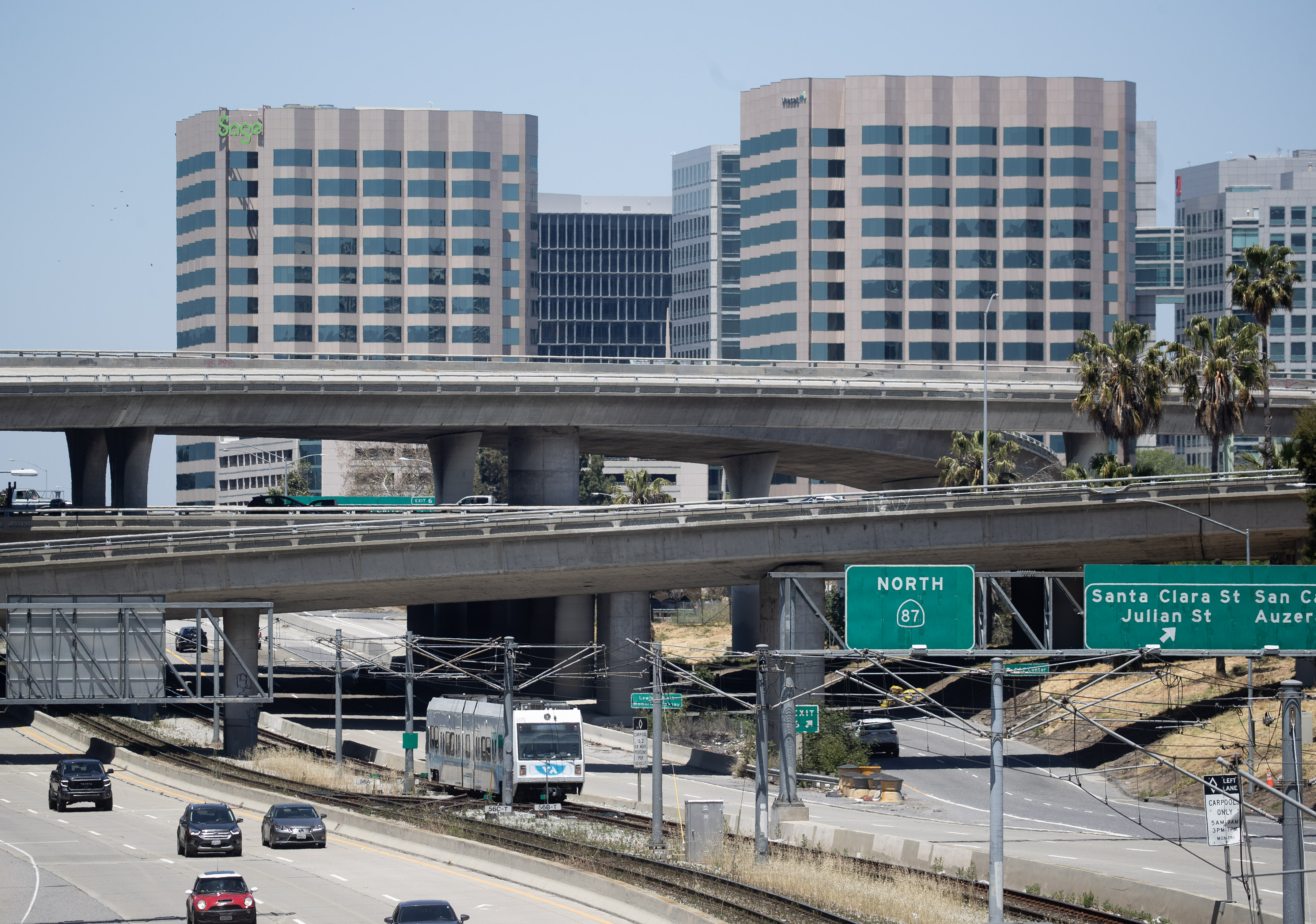Buildings in downtown San Jose, Calif., rise up beyond the Interstate 280-Highway 87 interchange, Thursday, May 18, 2023.