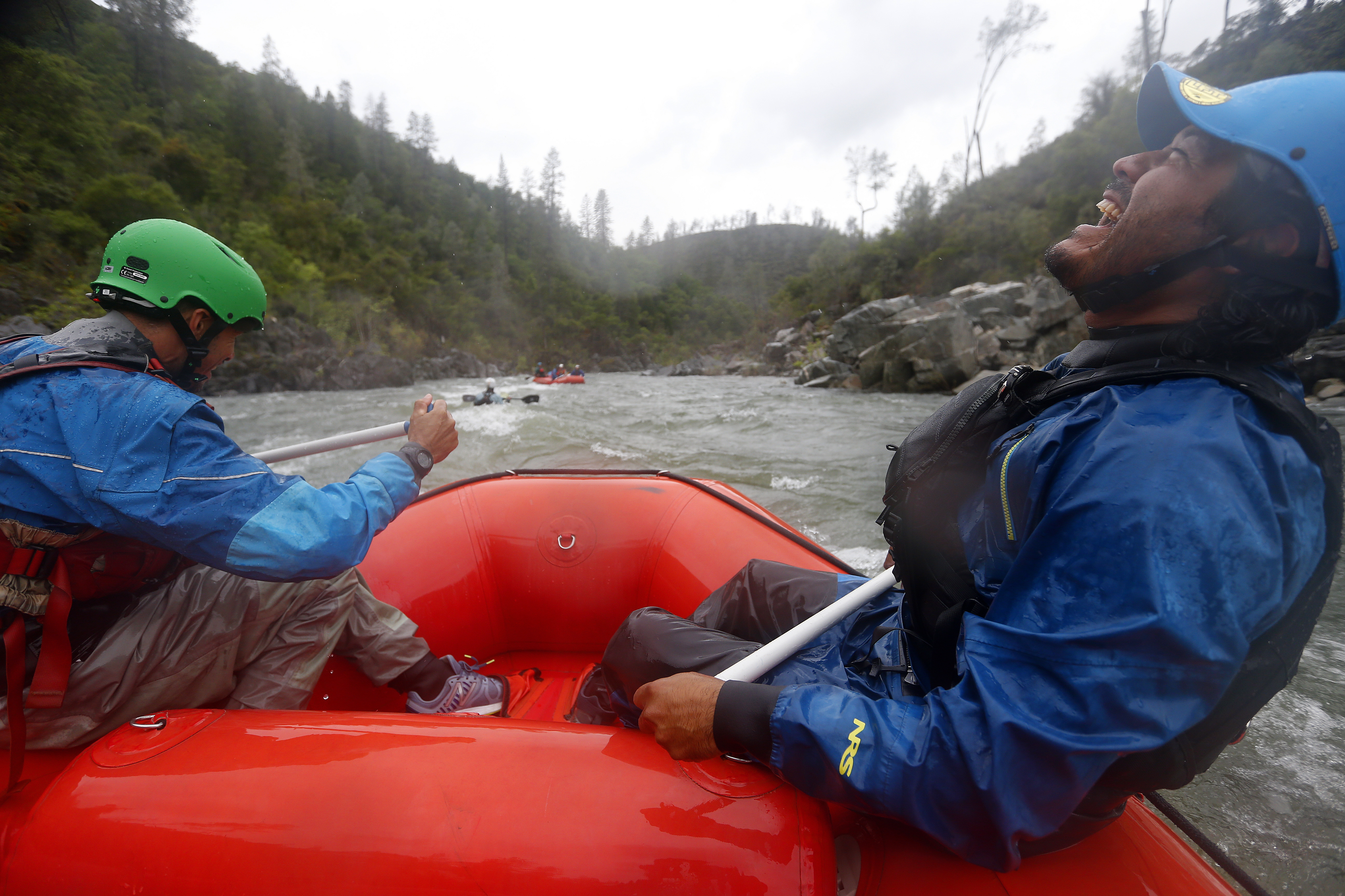 Guides Gilson Jonas, left, and Andres Suarez, right, with American Whitewater Expeditions raft down the South Fork of the American River on Thursday, May 4, 2023, near Coloma, Calif. (Aric Crabb/Bay Area News Group)