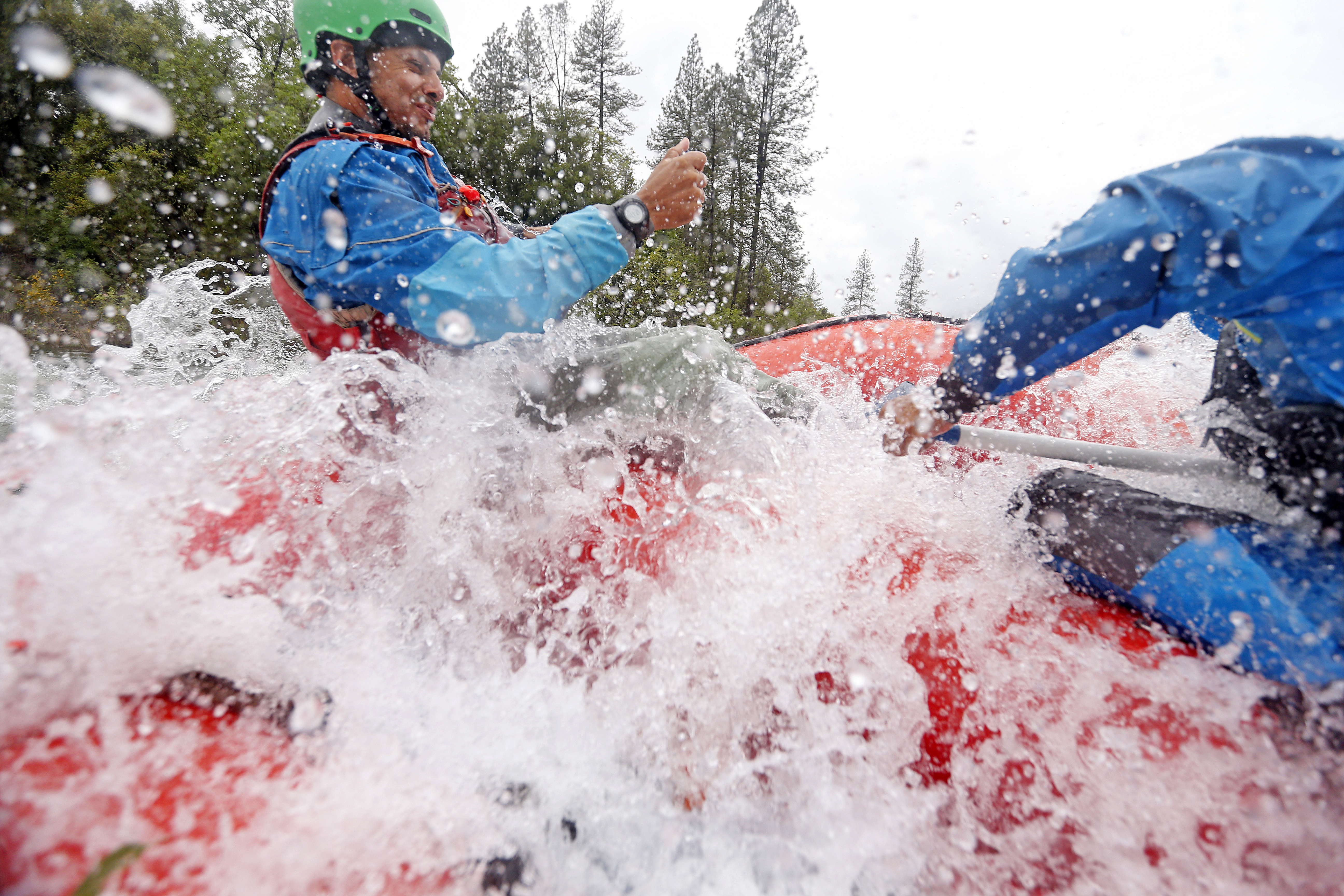 Guides Gilson Jonas, left, and Andres Suarez, right, with American Whitewater Expeditions raft down the South Fork of the American River on Thursday, May 4, 2023, near Coloma, Calif. (Aric Crabb/Bay Area News Group)