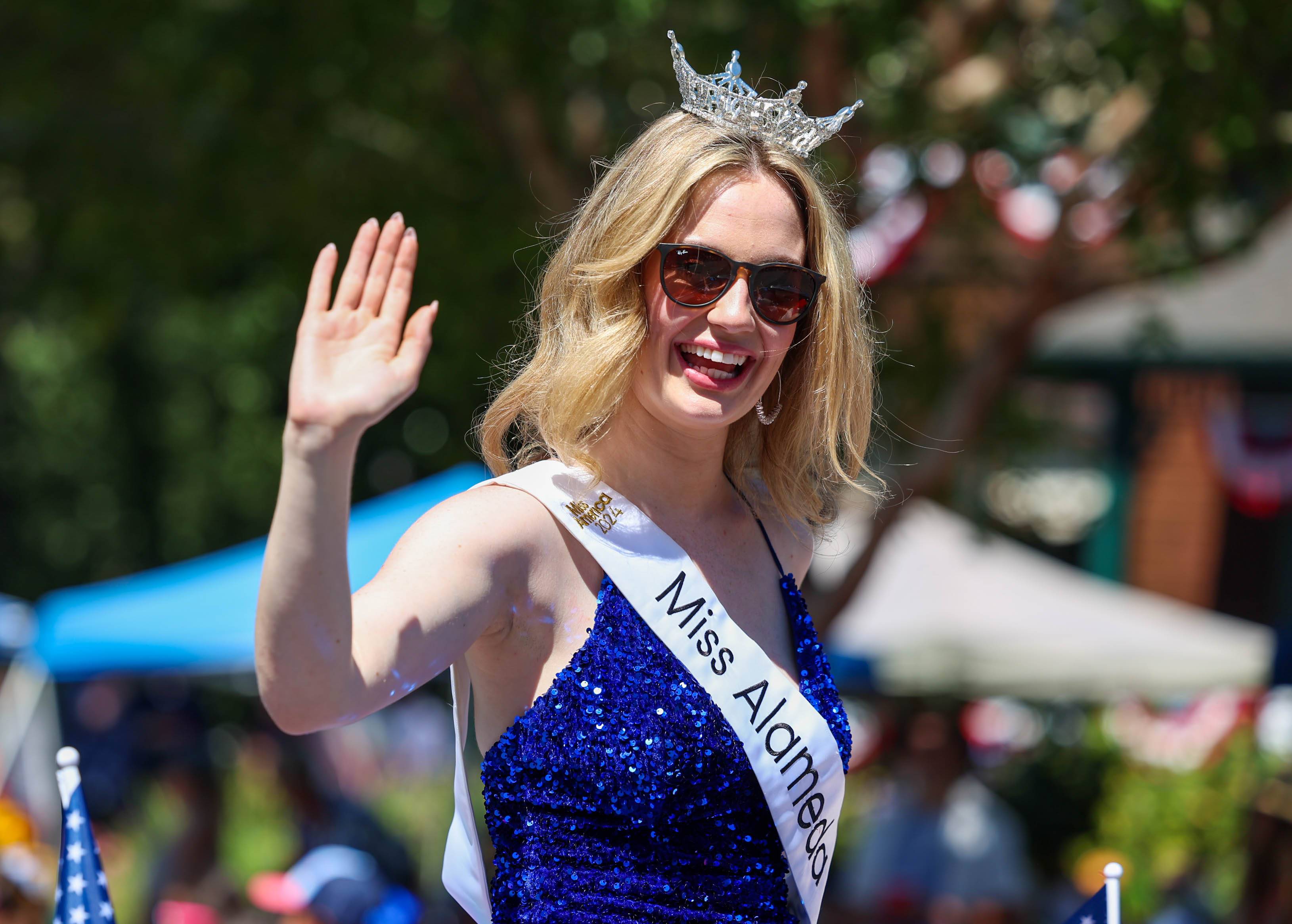 Miss Alameda County, Delaney O'Connell, waves at the crowd during the annual Fourth of July Parade in Alameda, Calif., on Thursday, July 4, 2024. (Ray Chavez/Bay Area News Group)