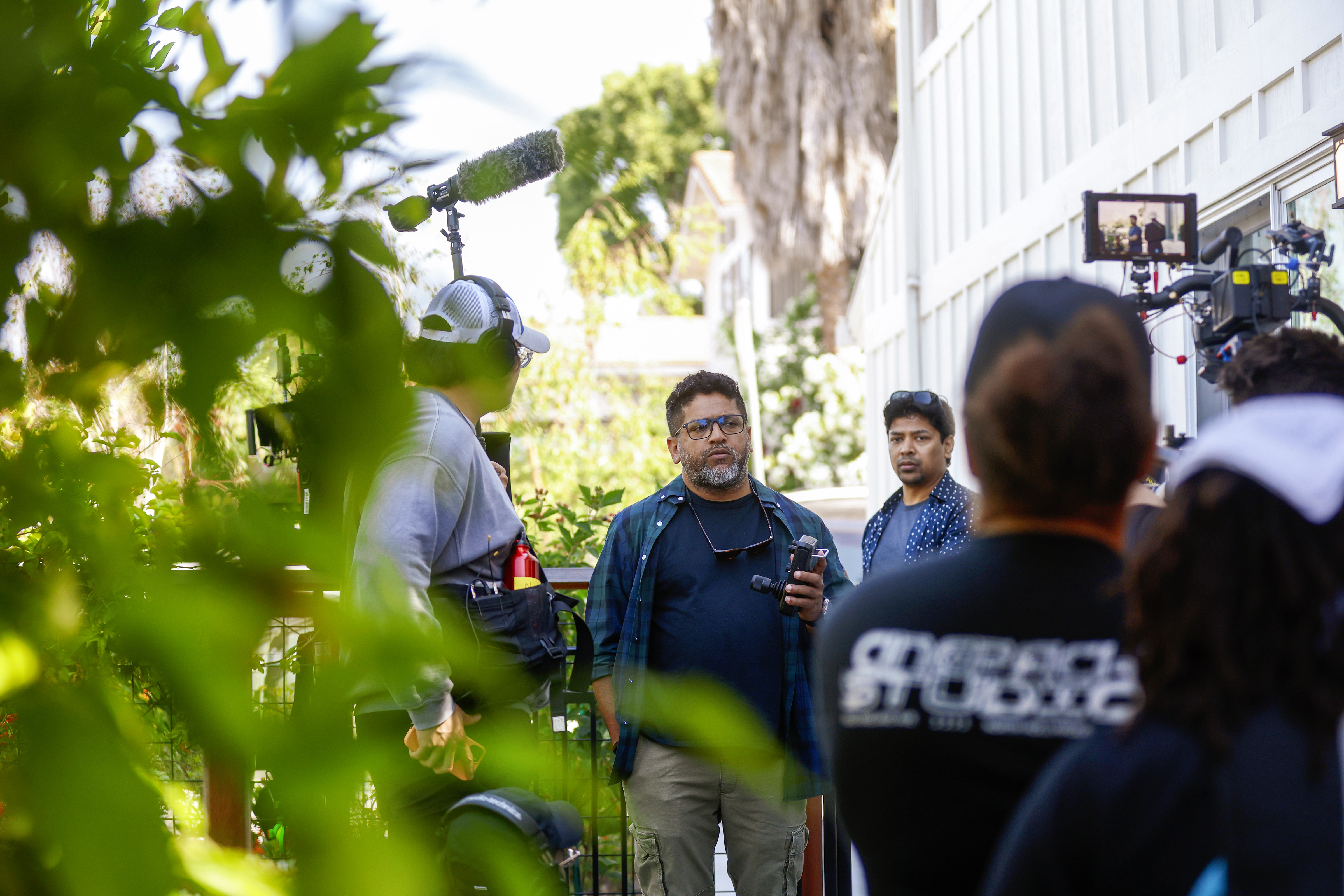 Unni Rav, a cinematographer based in the Bay Area, center, directs a movie at an Airbnb in San Jose, Calif., on Friday, June 21, 2024. (Shae Hammond/Bay Area News Group)