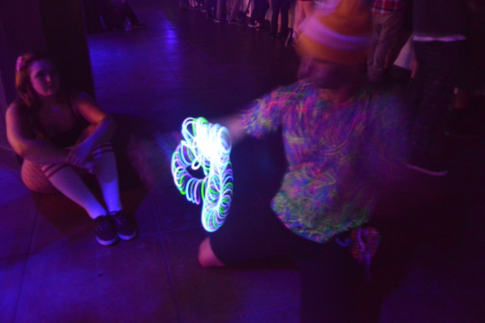 Concert goer giving light show