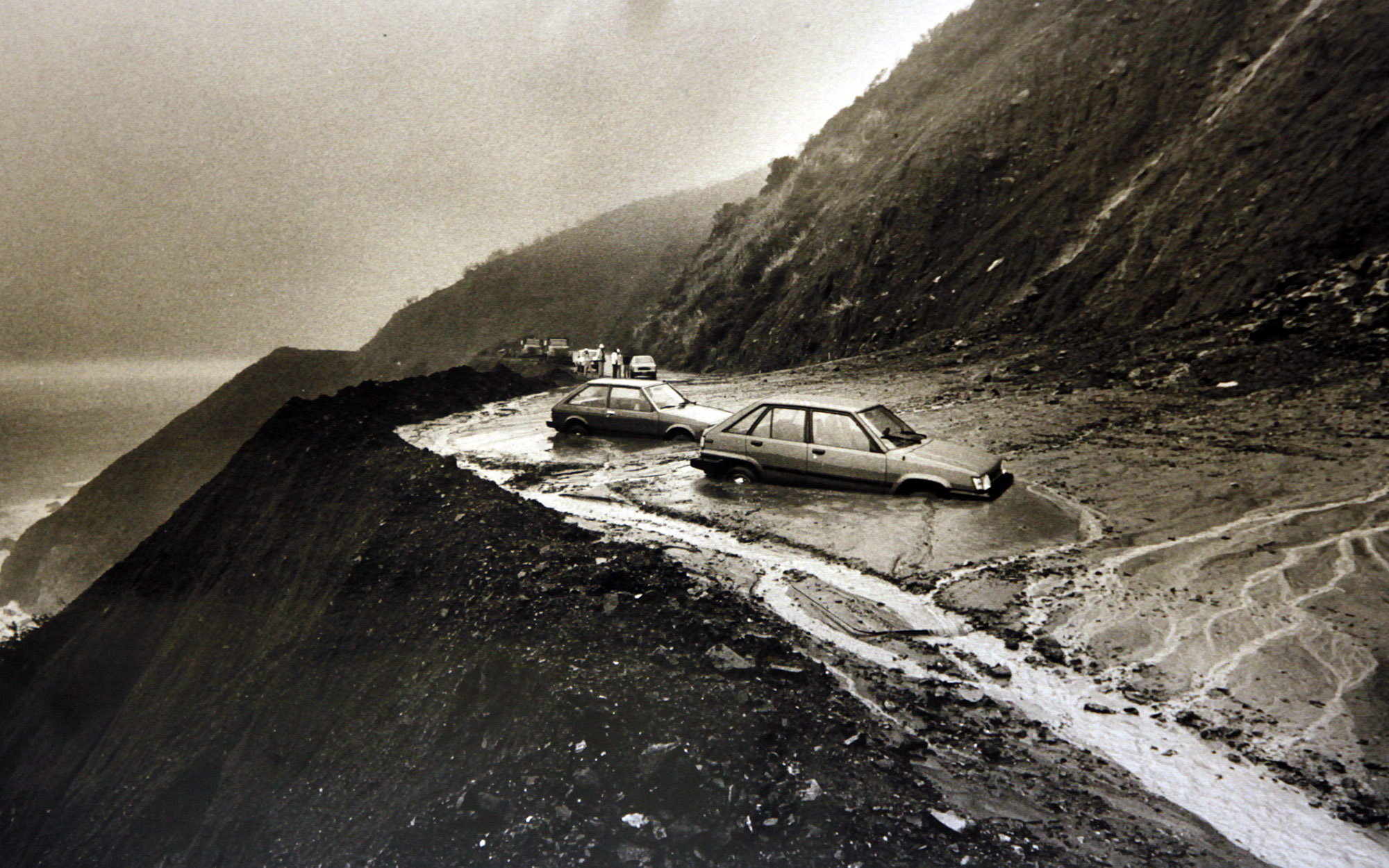 Vehicles get trapped in a mudslide on Highway 1 just south of Esalen on Feb. 13, 1987. The major winter storm caused this section of roadway to be closed for weeks.