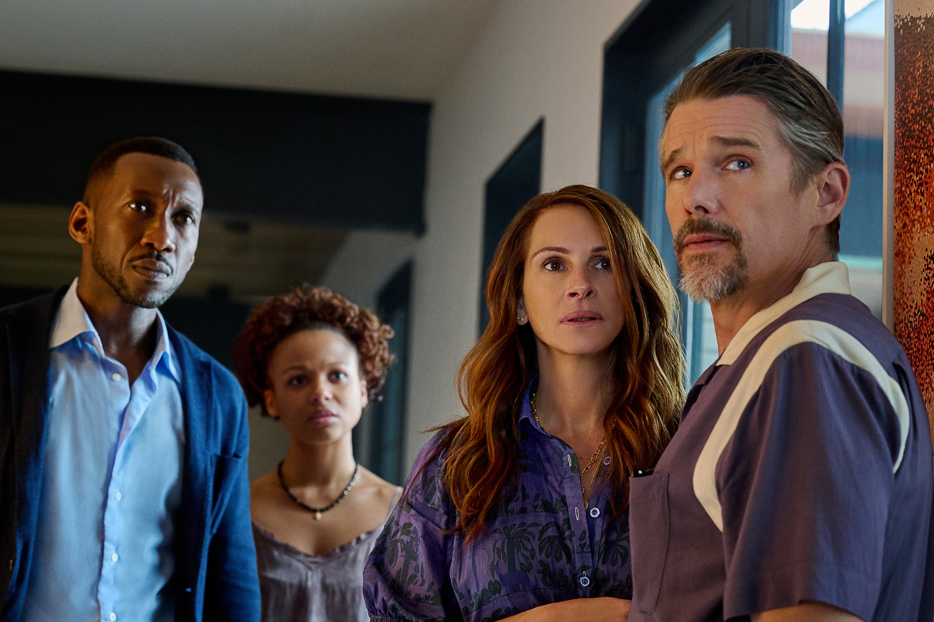 Mahershela Ali, left, Myha'la Herrold, Julia Roberts and Ethan Hawke appear in a scene from "Leave the World Behind." (Courtesy of Netflix)