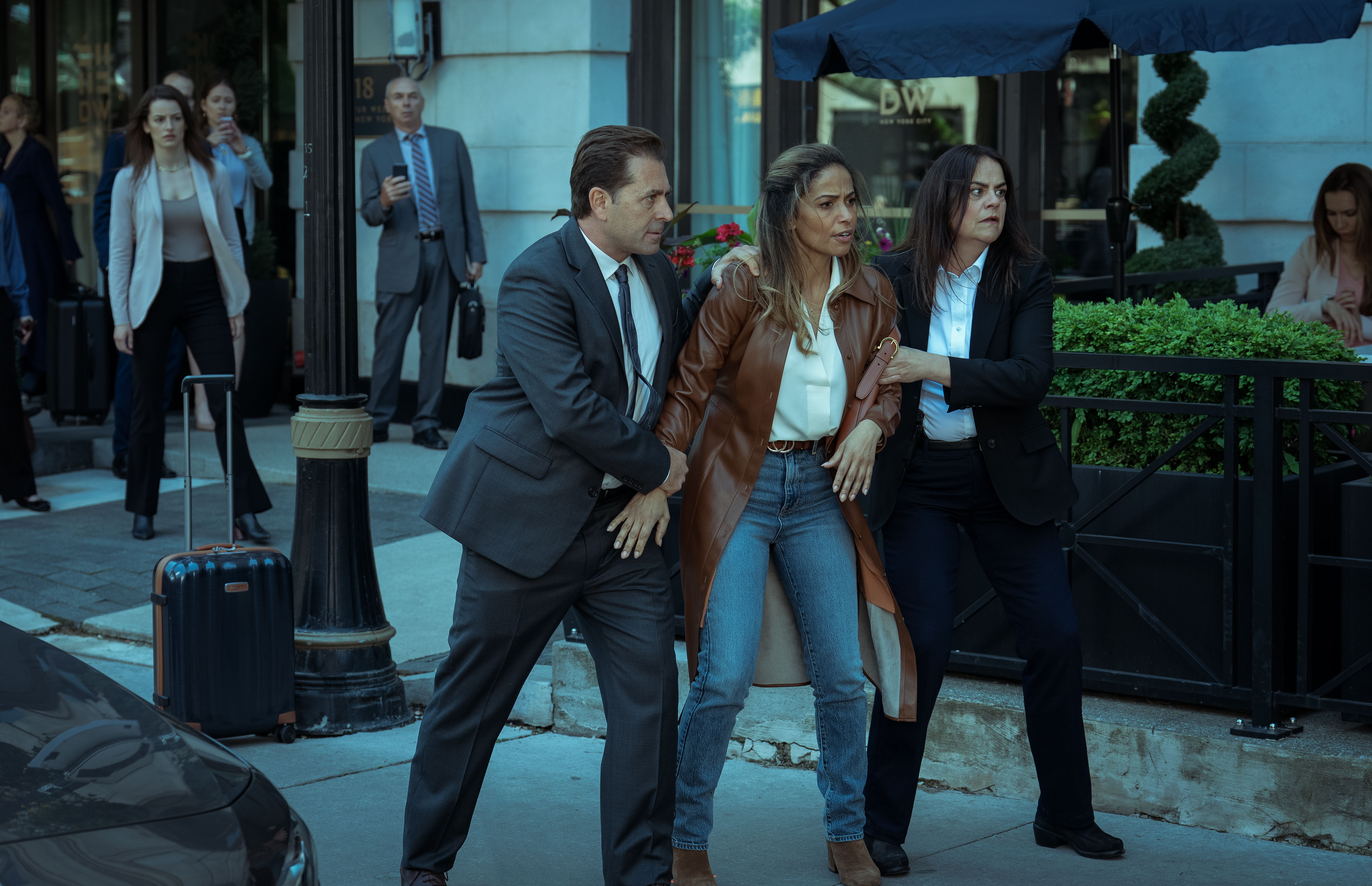 Meta Golding's Hailey Winton runs afoul os a couple of folks claiming to be with law enforcement in a scene from the Paramount+ series "Rabbit Hole." (Courtesy of Paramount+)