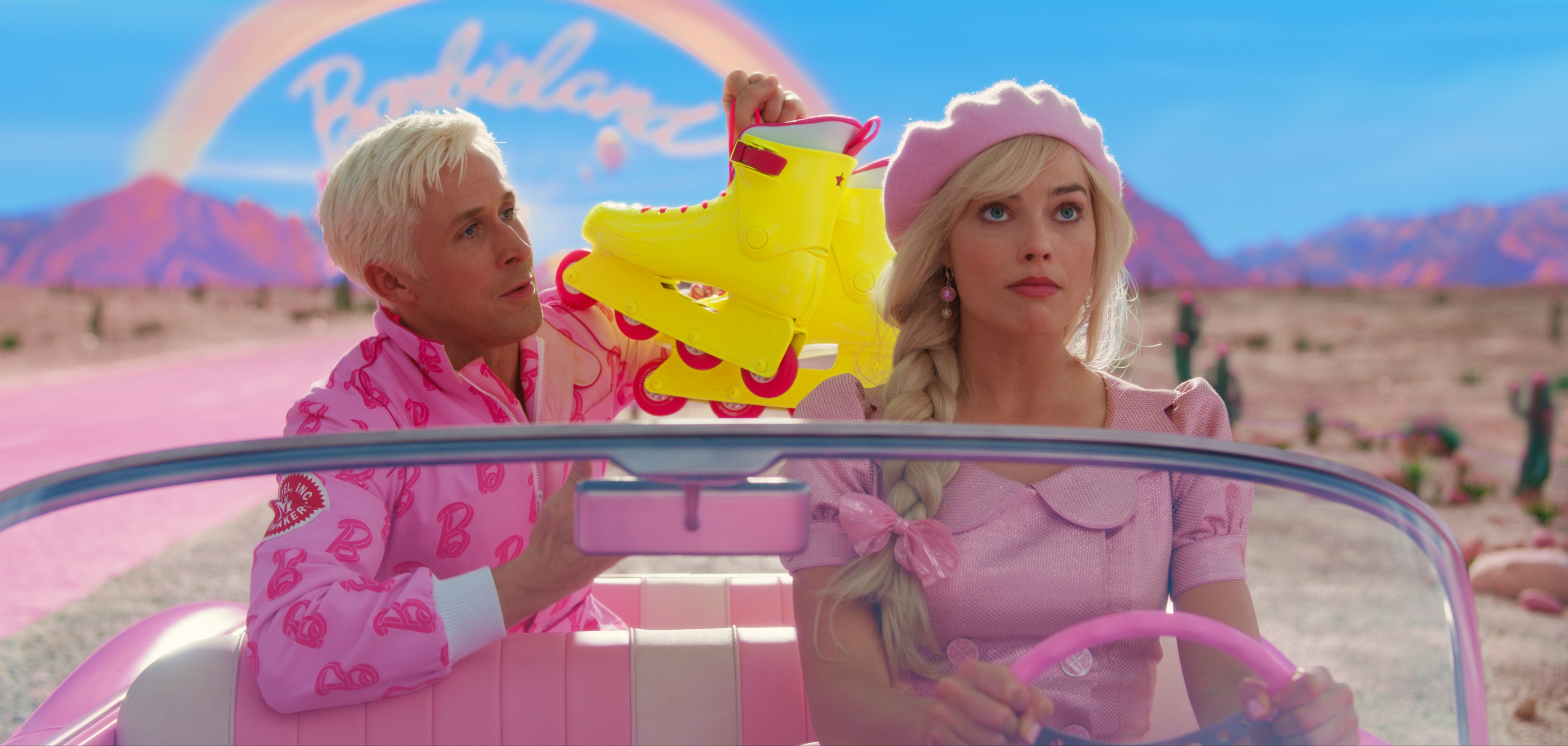Barbie (Margot Robbie) and Ken (Ryan Gosling) are off for a real-world adventure in "Barbie." (Courtesy of Warner Bros. Pictures)
