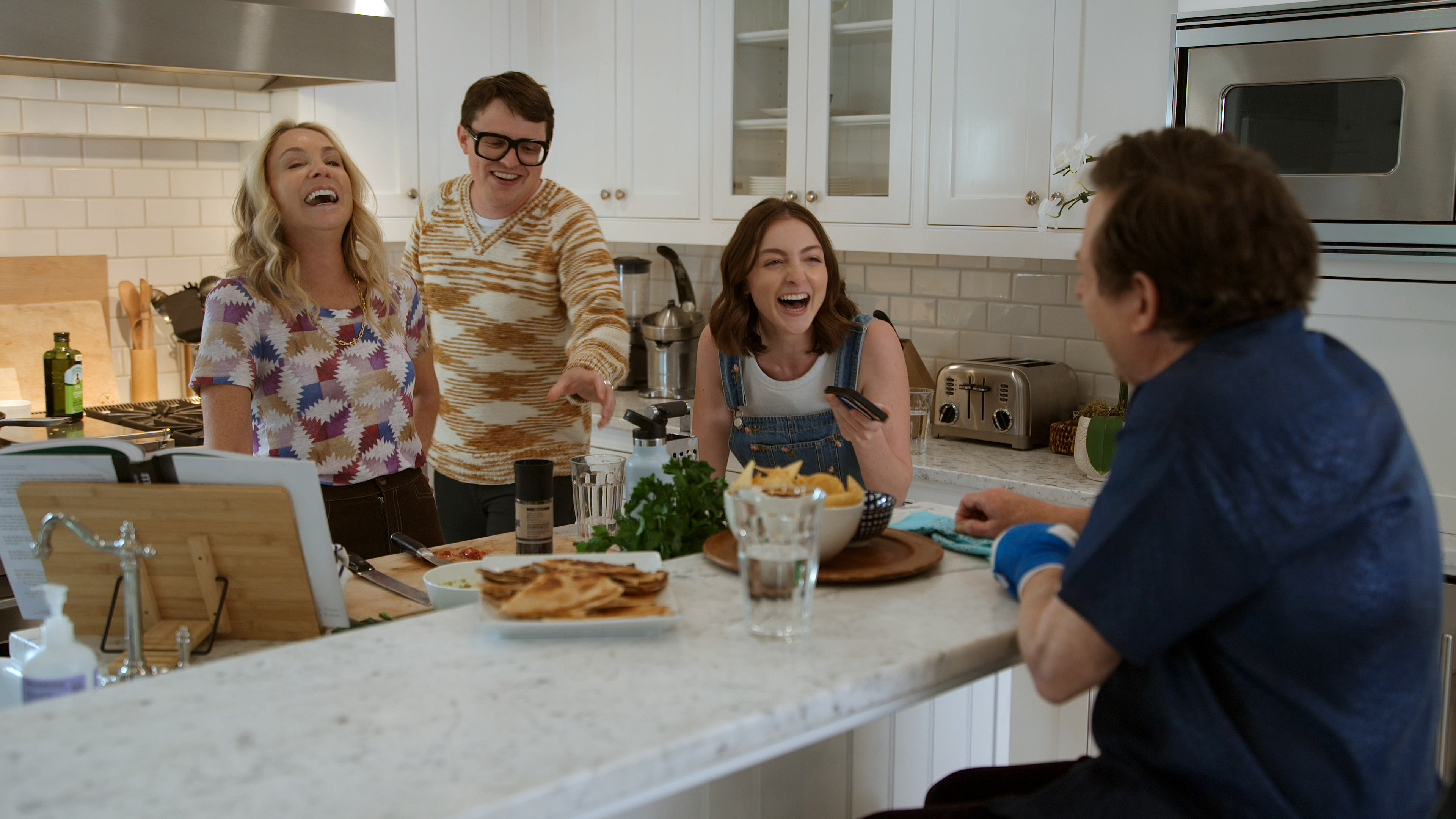 Michael J. Fox enjoys a moment with his wife, Tracy Pollan, and their children Sam and Esme Fox in "Still: A Michael J. Fox Movie." (Courtesy of Apple TV+)