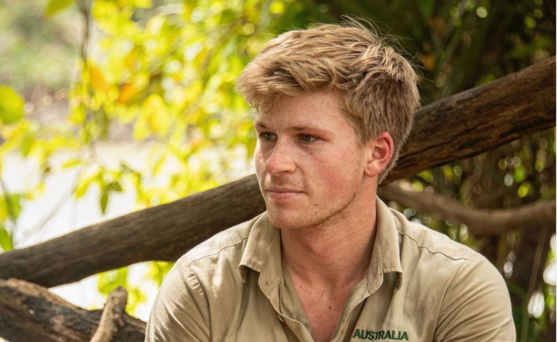 Robert Irwin wears khaki looks to the left