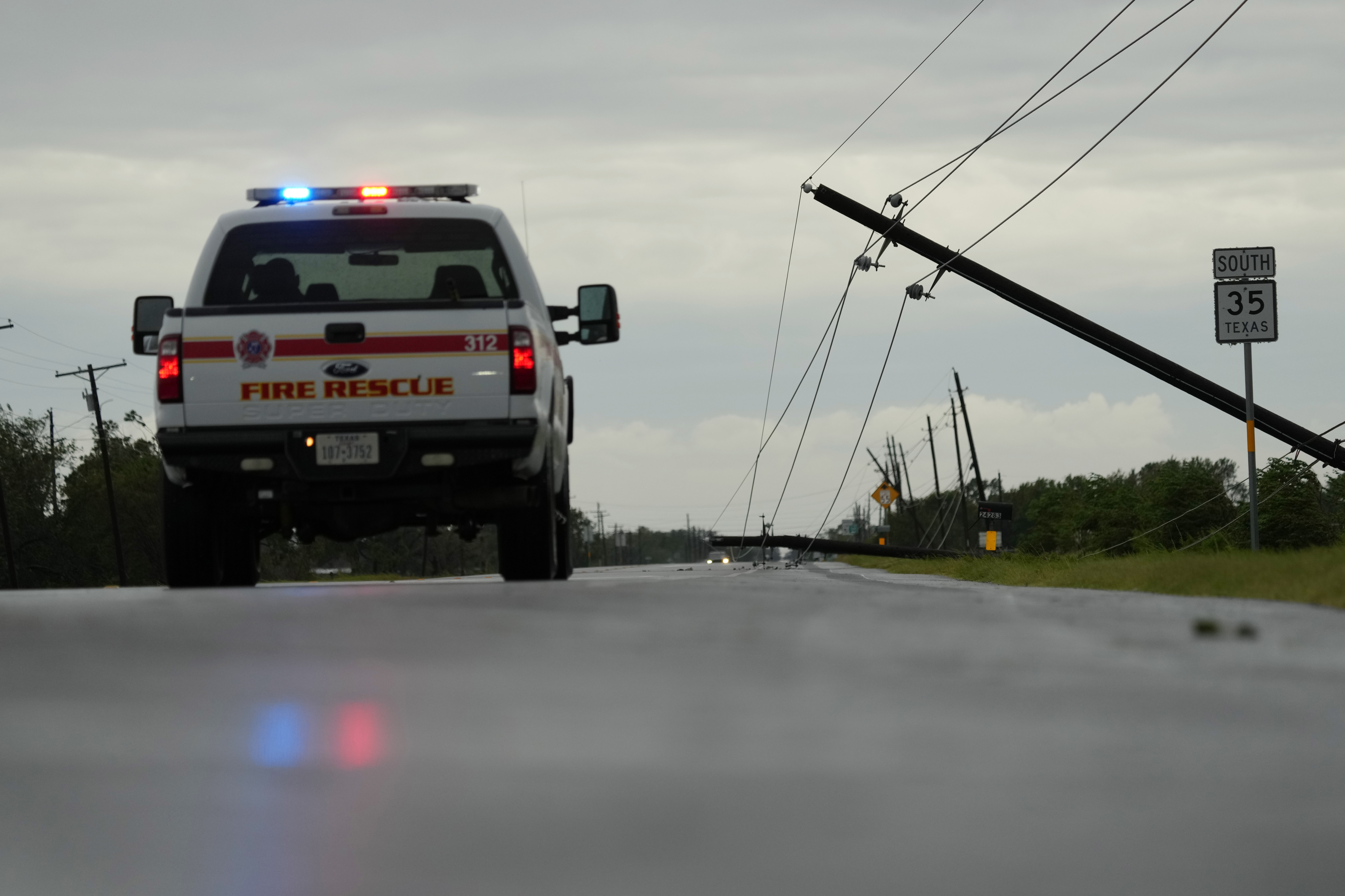 Power lines downed by the effects of Hurricane Beryl block a highway near Palacios, Texas, Monday, July 8, 2024. (AP Photo/Eric Gay)