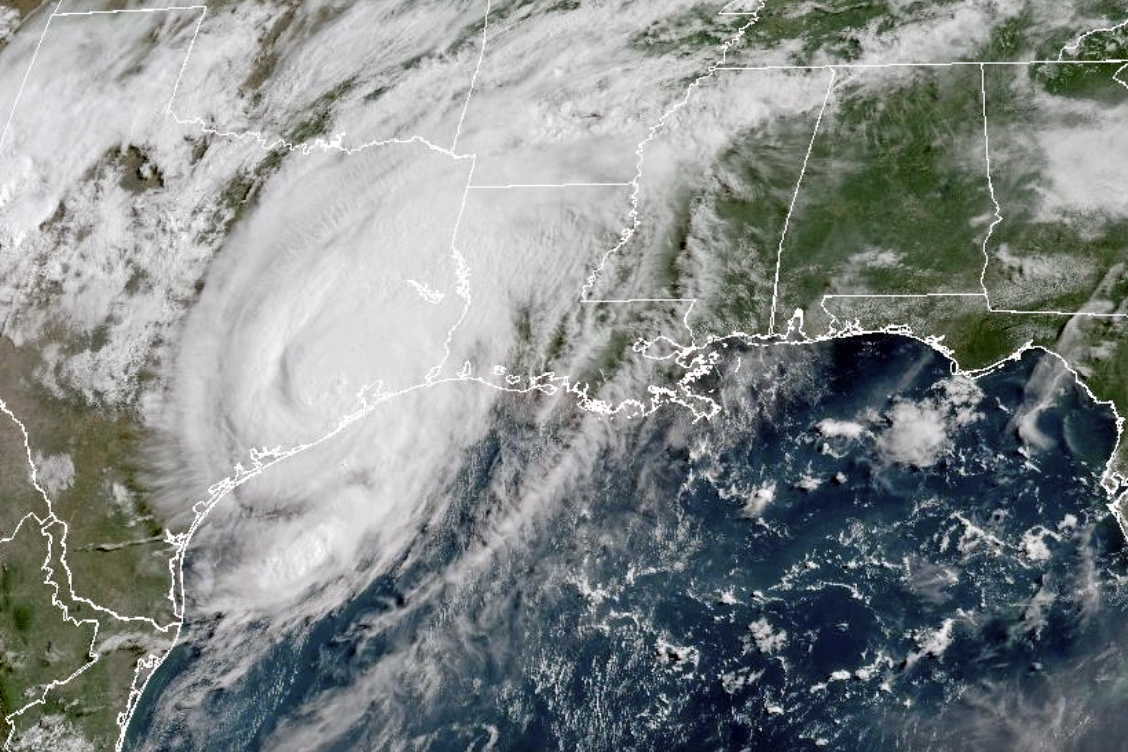 This GOES-16 GeoColor satellite image taken at 10:11 a.m. EDT on Monday, July 8, 2024, and provided by NOAA, shows Tropical Storm Beryl over Texas. Hurricane Beryl swept into Texas early Monday with heavy rains and powerful winds, knocking out power to 1.5 million homes and businesses and flooding streets with fast-rising waters as first responders raced to rescue stranded residents. (NOAA via AP)