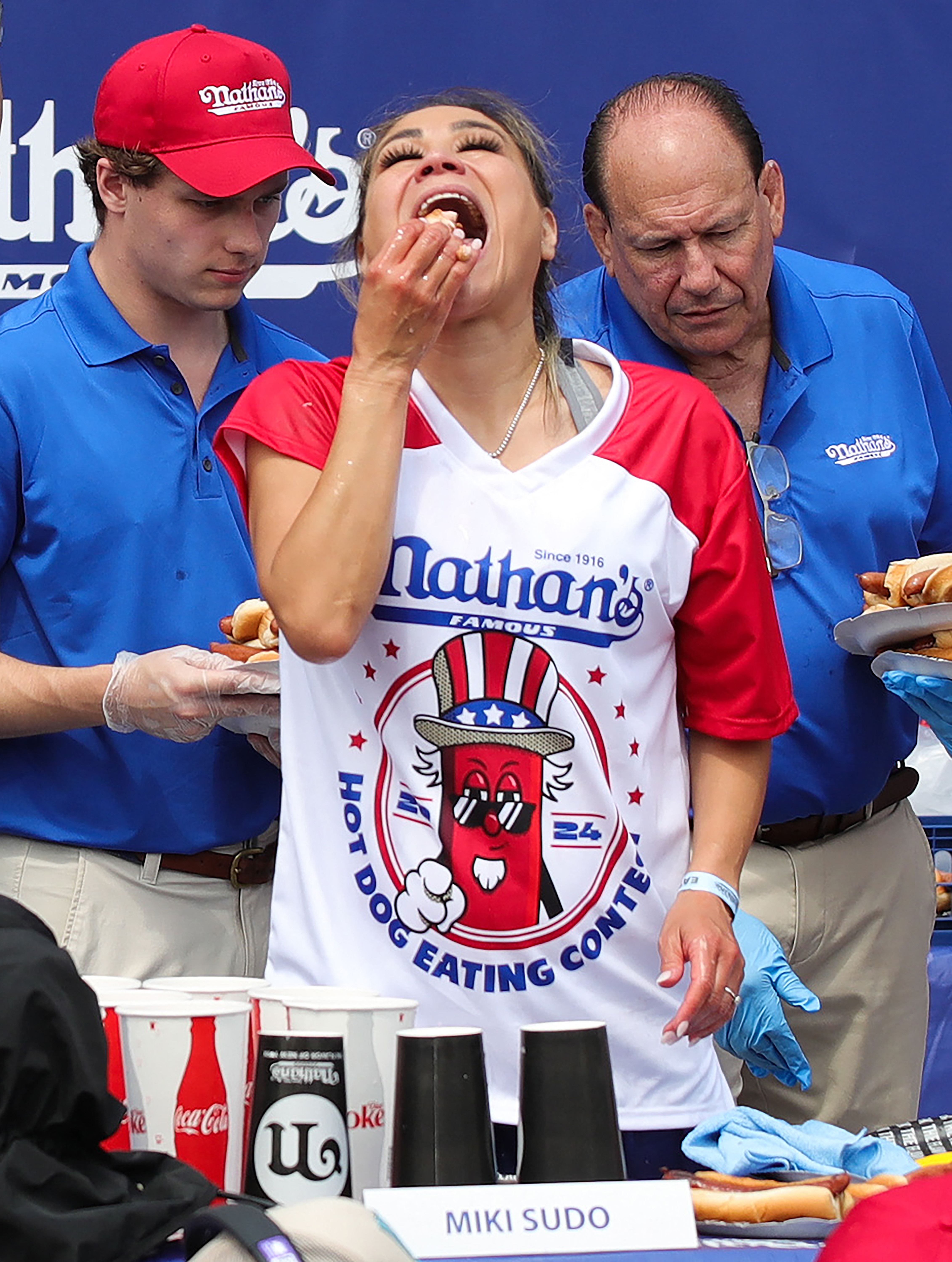 Miki Sudo competes for the women's title during the 2024 Nathan's Famous Fourth of July hot dog eating competition at Coney Island in the Brooklyn borough of New York on July 4, 2024. Sudo won after consuming a record-breaking 51 hotdogs. (Photo by Leonardo Munoz / AFP) (Photo by LEONARDO MUNOZ/AFP via Getty Images)