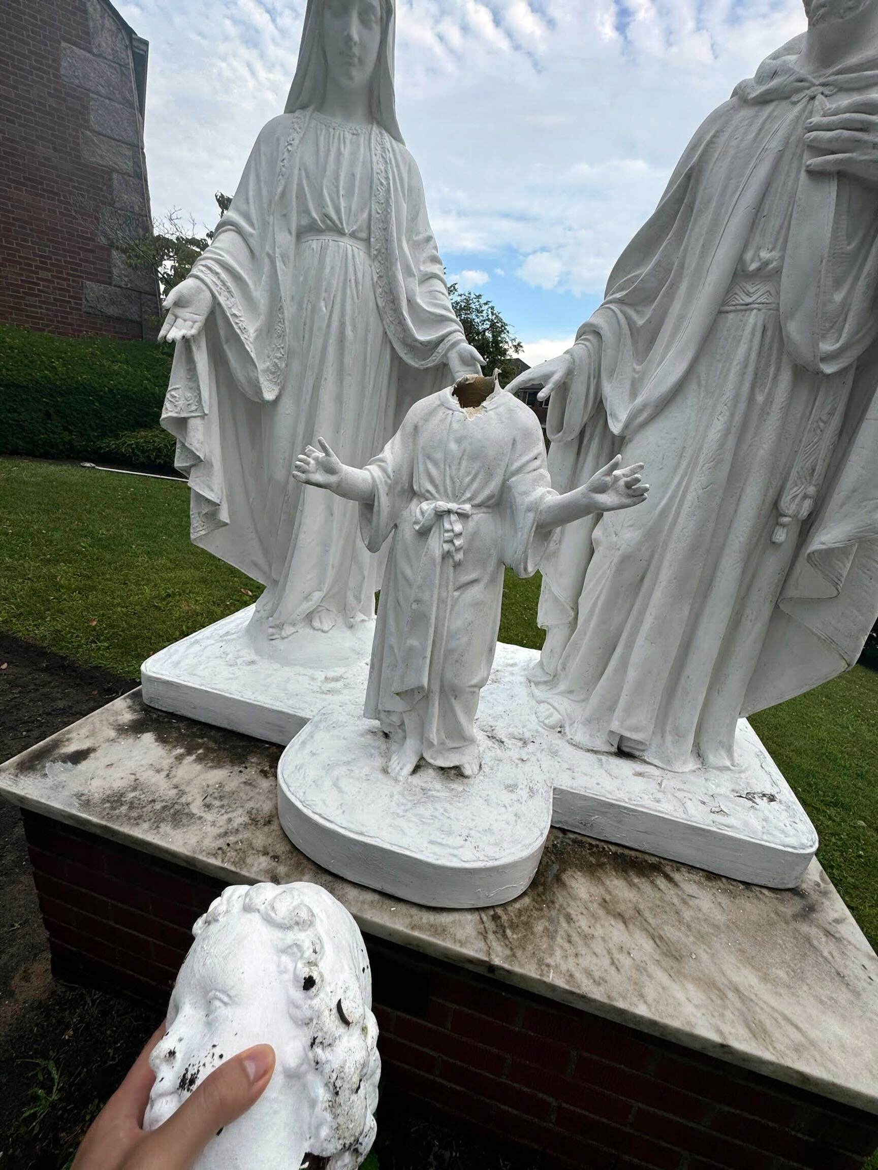 A yellow cab driver decapitated a statue of Jesus Christ at a Queens church after the vandal parked his car, a yellow taxi SUV, across the street from the Holy Family Roman Catholic on the corner of 74th Ave. and 175th St. in Fresh Meadows around 5:30 a.m. Sunday, June, 30, 2024. (Courtesy of the Diocese of Brooklyn)