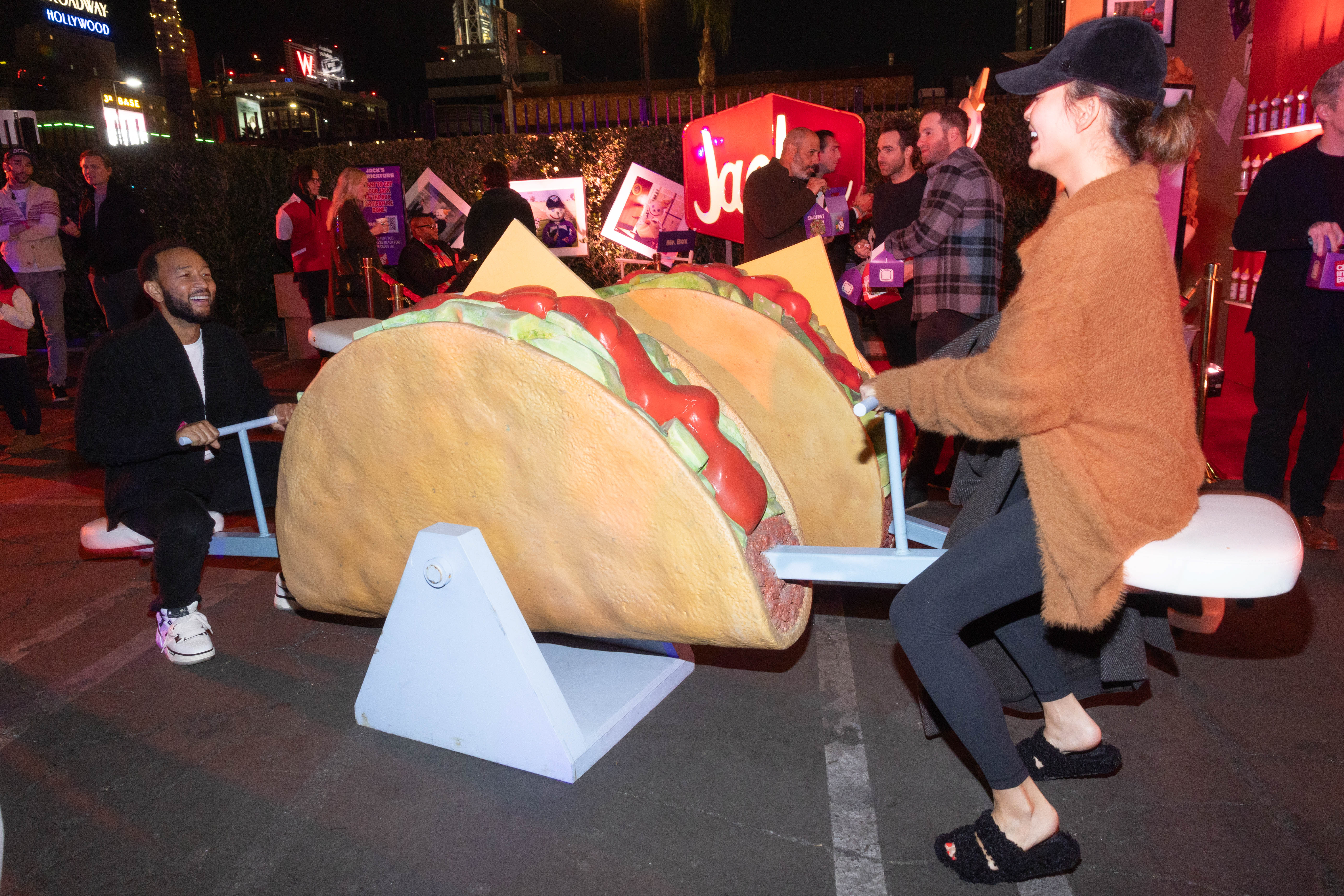 John Legend and Chrissy Teigen on a taco seesaw at the first ChainFEST in Los Angeles in 2023. (Courtesy of ChainFEST)