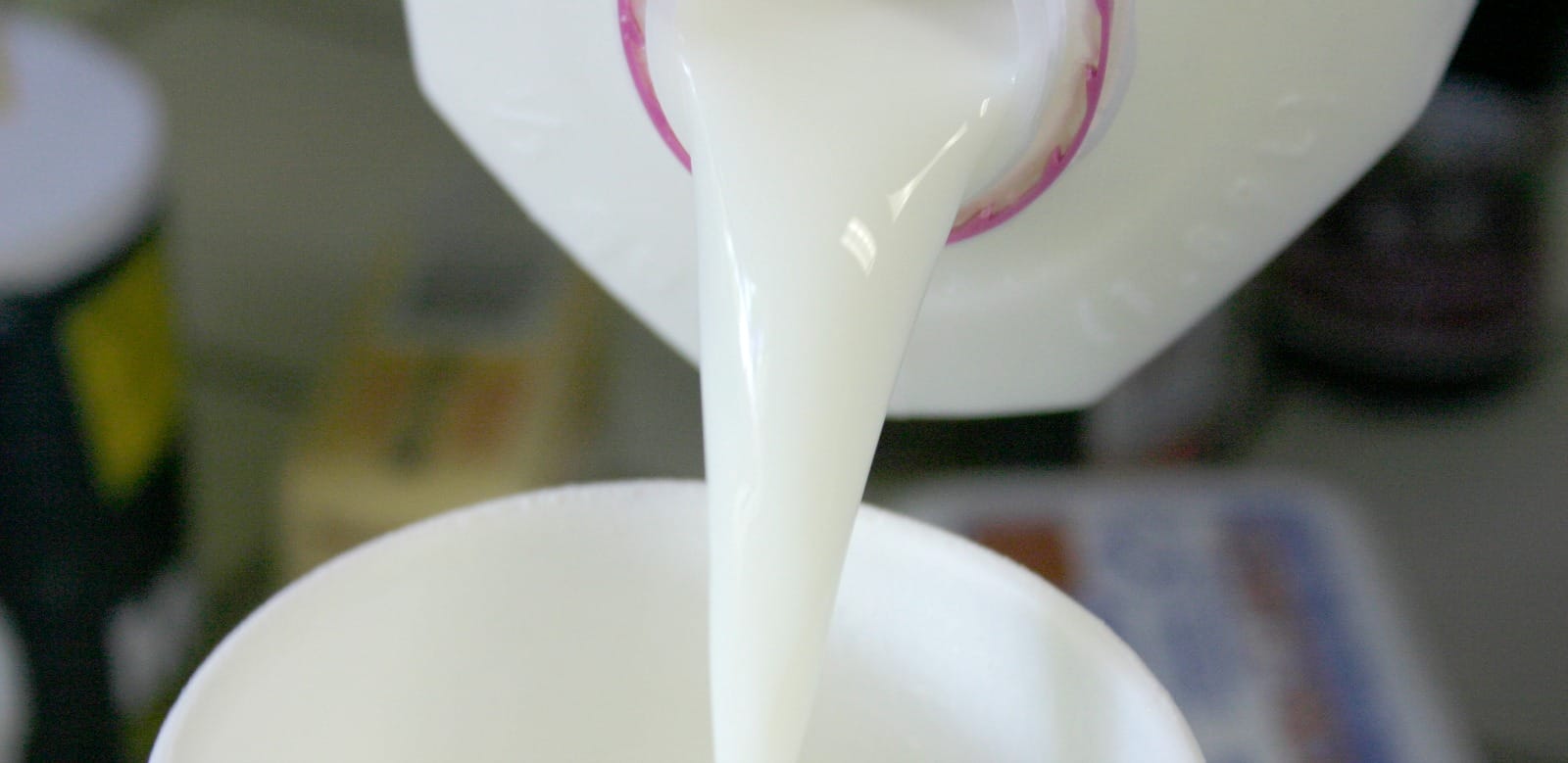 pouring milk into a bowl
