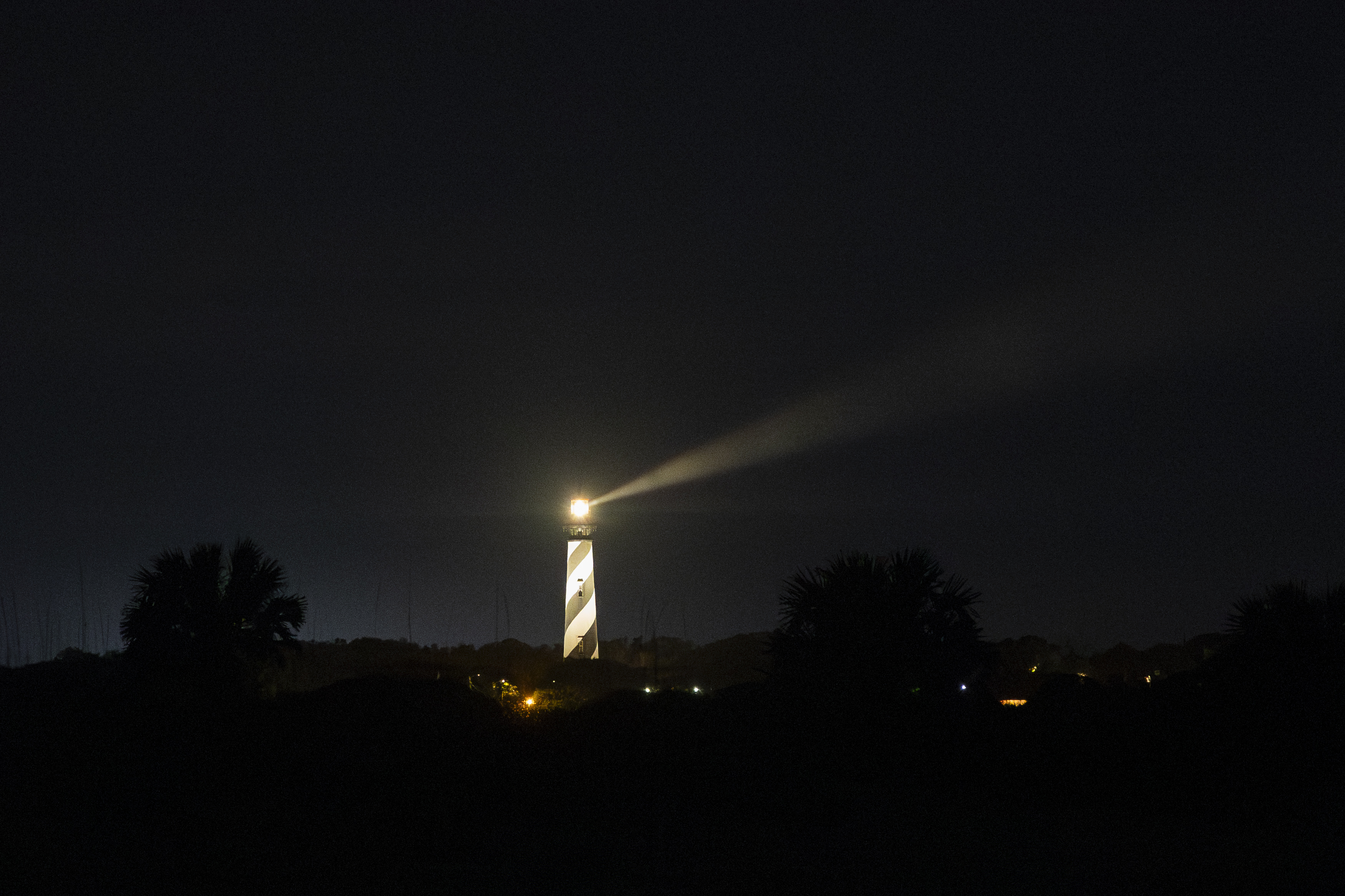 The St. Augustine Lighthouse glows in the nighttime as seen from Anastasia State Park on March 7, 2024. (Patrick Connolly/Orlando Sentinel)