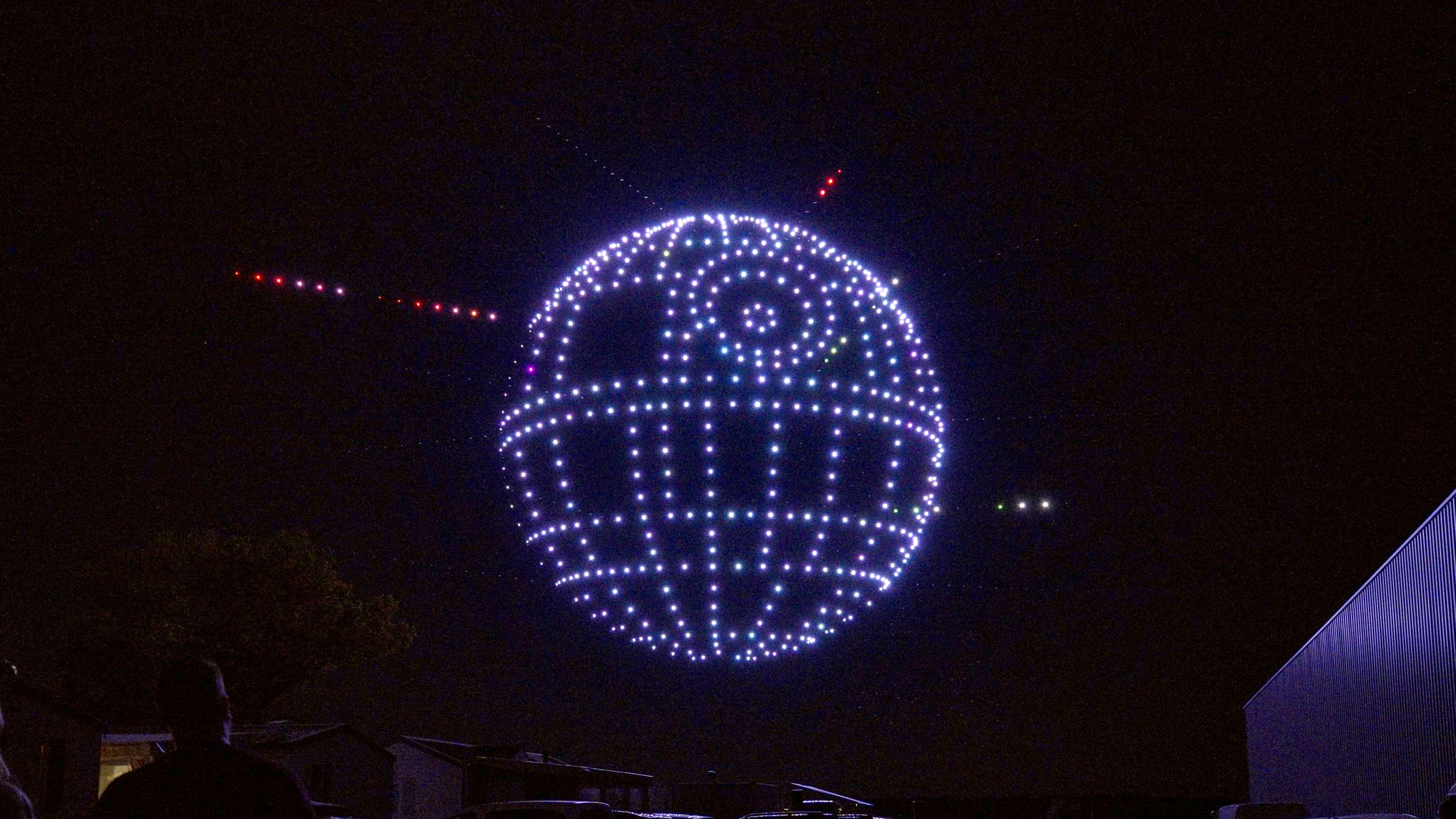 Drones form various scenes from film and television in the sky, including the Death Star from Lucas Film's "Star Wars" franchise, during testing in France of the new nighttime show coming to Walt Disney World. The limited-time show, "Disney Dreams That Soar" runs at Disney Springs from May 24 to Aug. 2, 2024, and utilizes cutting-edge drone technology to feature a collection of fan-favorite characters utilizing cutting-edge technology and 800 drones, plus LED lights, choreographed to a sweeping original music score.. (Sylvain Beche, photographer)