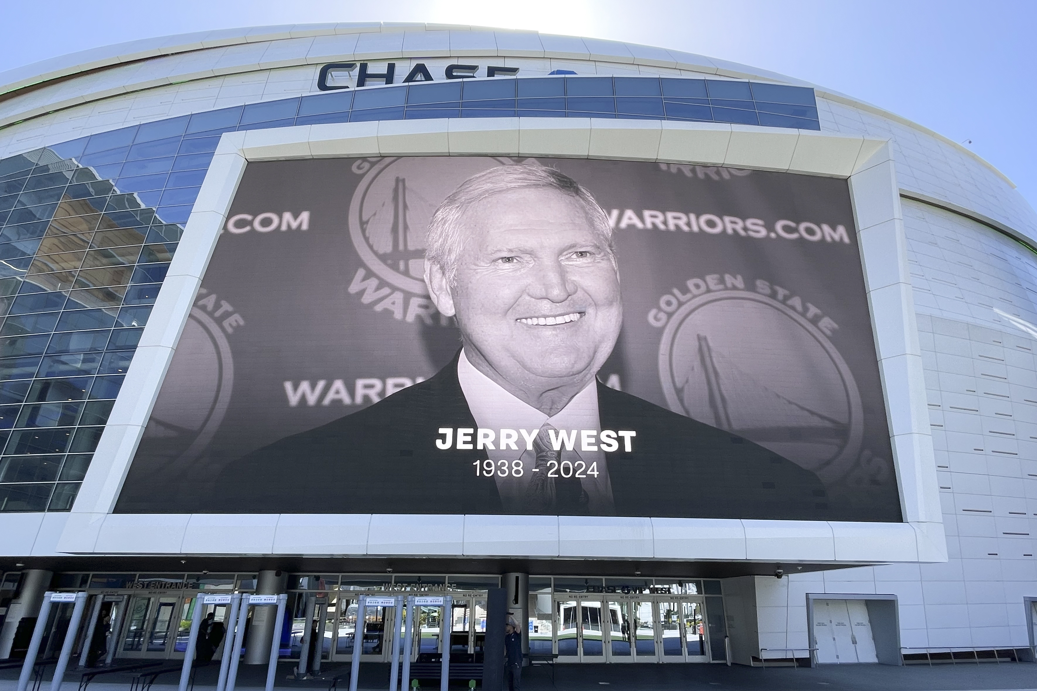 An image of Jerry West is displayed outside Chase Center on Wednesday in San Francisco. West, who was selected to the Basketball Hall of Fame three times in a storied career as a player and executive, and whose silhouette is the basis of the NBA logo, died. West served as an executive with Golden State during its championship reign. (Haven Daley/AP)