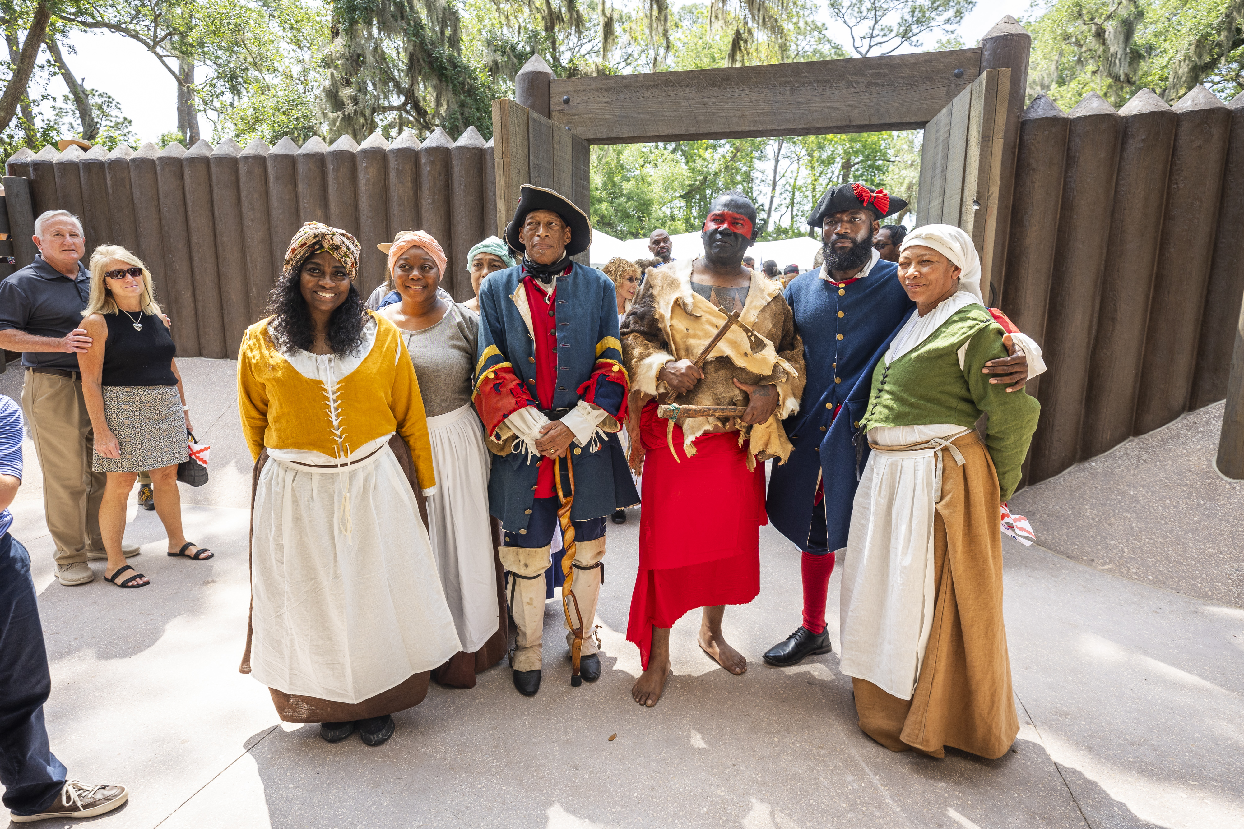 Reenactors gather for a photo during a ribbon-cutting ceremony for a new replica 1738 fort at Fort Mose Historic State Park in St. Augustine on May 9. (Patrick Connolly/Orlando Sentinel)