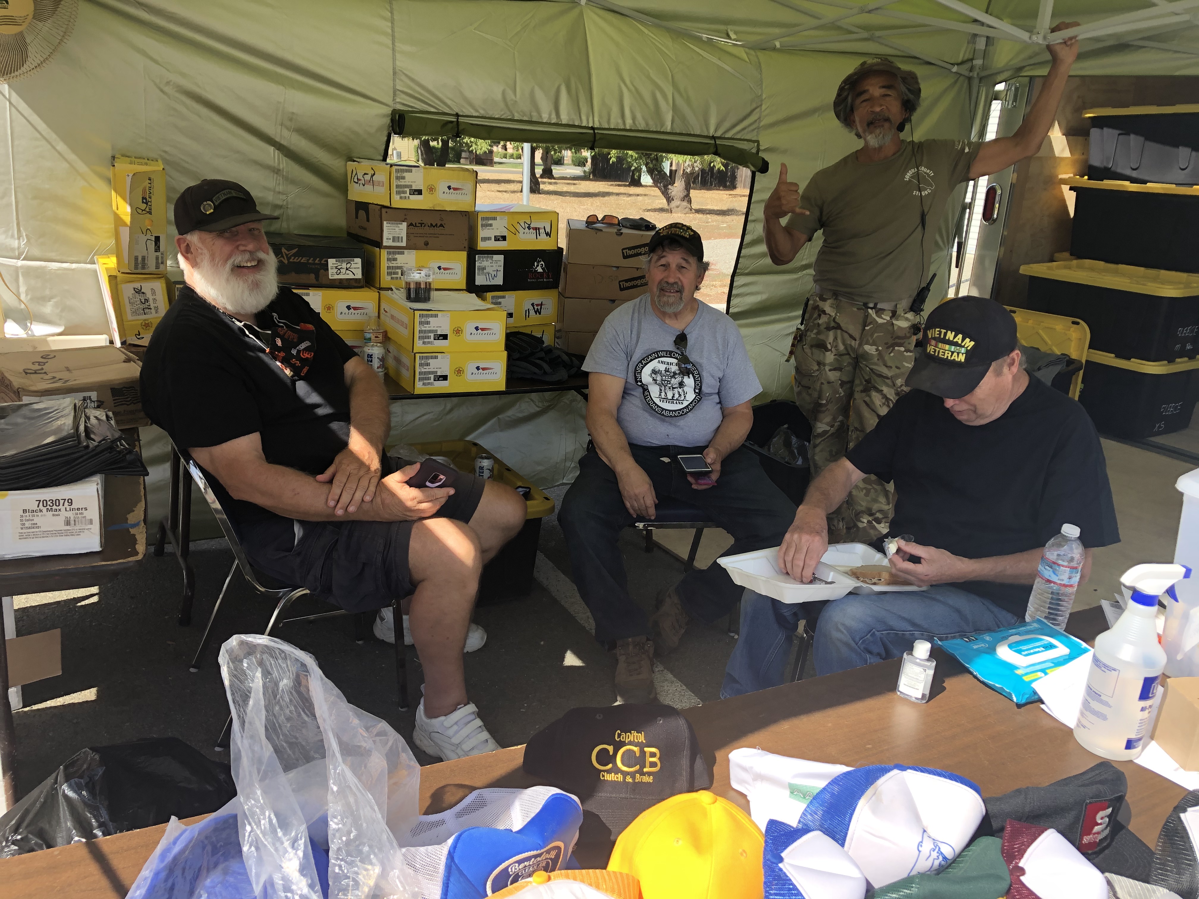 (File photo- LAKE COUNTY PUBLISHING)Members of the Vietnam Veterans of America Redwood Empire Chapter 223 based out of Santa Rosa (Left to Right) Joe Cholewa, Dan Stover, Tony Rambonga (standing) and another member who asked his name not be used, volunteer at the Veteran Stand Down event outside the Clearlake Senior Community Center at an event in 2020.