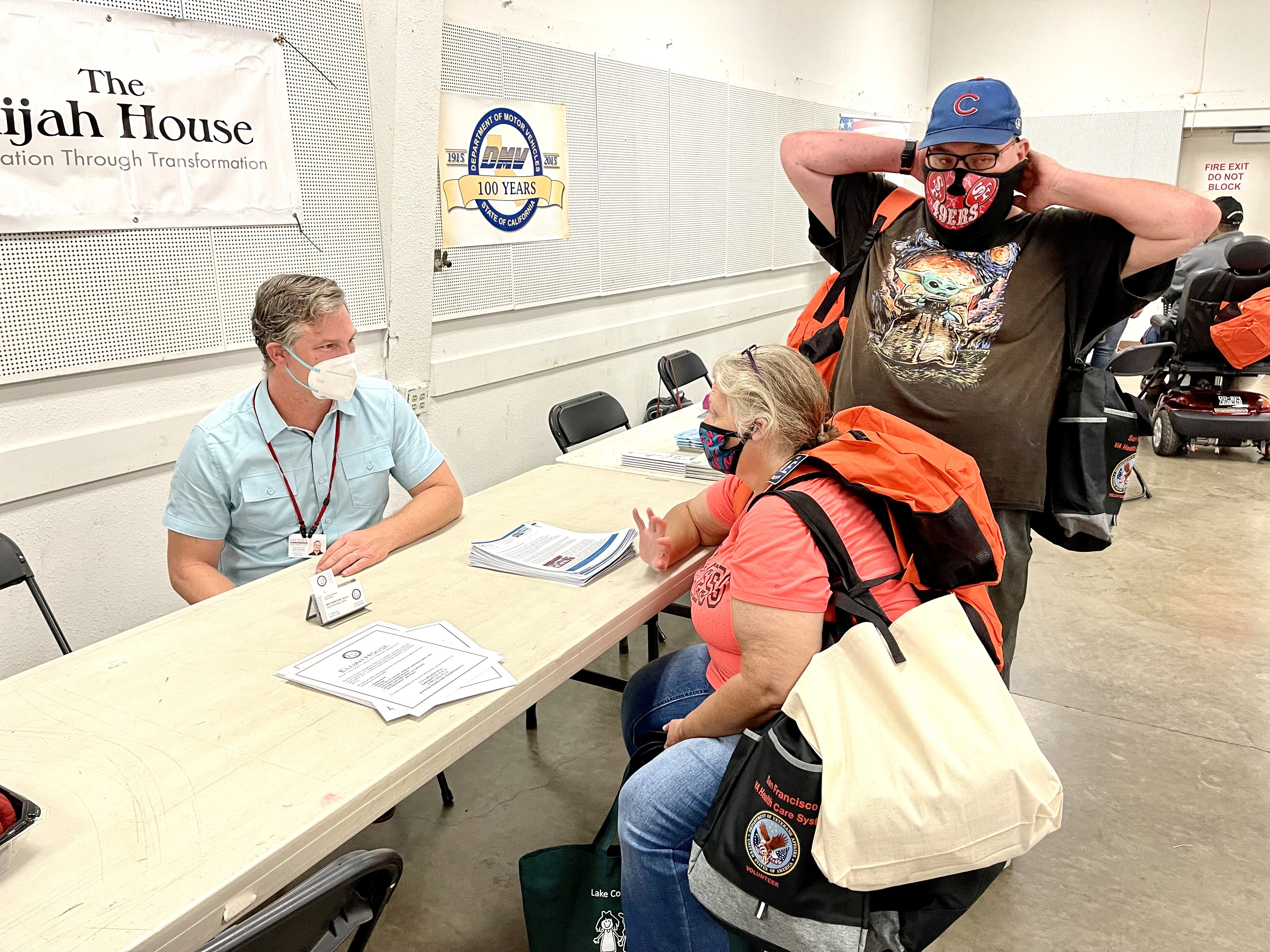 Sharon Oubre from Louisiana with her brother Jason Souzer talk to Justin Ammon from Elijah House last year about finding housing after Hurricane Ida destroyed her house and her father's (a veteran) house. (File photo-LAKE COUNTY PUBLISHING)