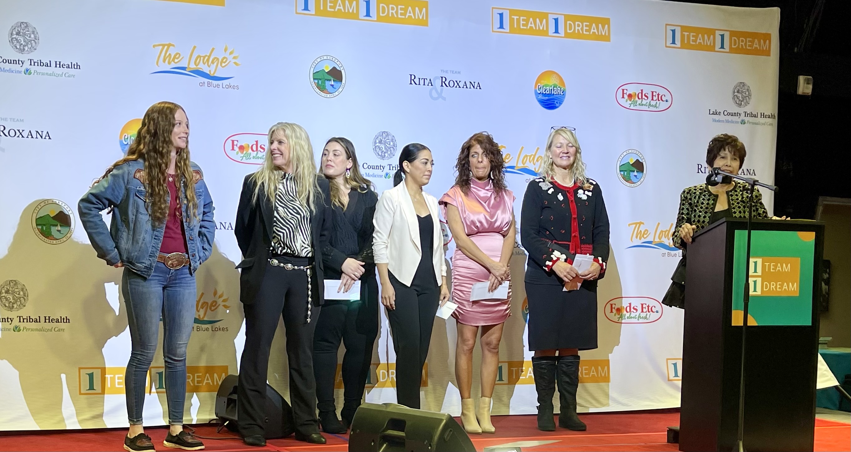 Award winners(left-rt): Brianna Elisabeth Thomas, Red Feather Leather/Founders Award, Catherine Ann Reese, Reese Ranch Retreat/First Place, Ashley Ruth Garrigus, Wild Hope Bakery/Fifth Place, Anahi Marie Silva, Party Ideas/Third Place, Jennifer Marie Gayda, Bottle Rock Candle Studio/Fourth Place, Valeri Ann Stallings, Send Rover on Over/Second Place and Fan Favorite Award, Maryann Schmid on mic. (Lucy Llewellyn Byard for the Record-Bee)