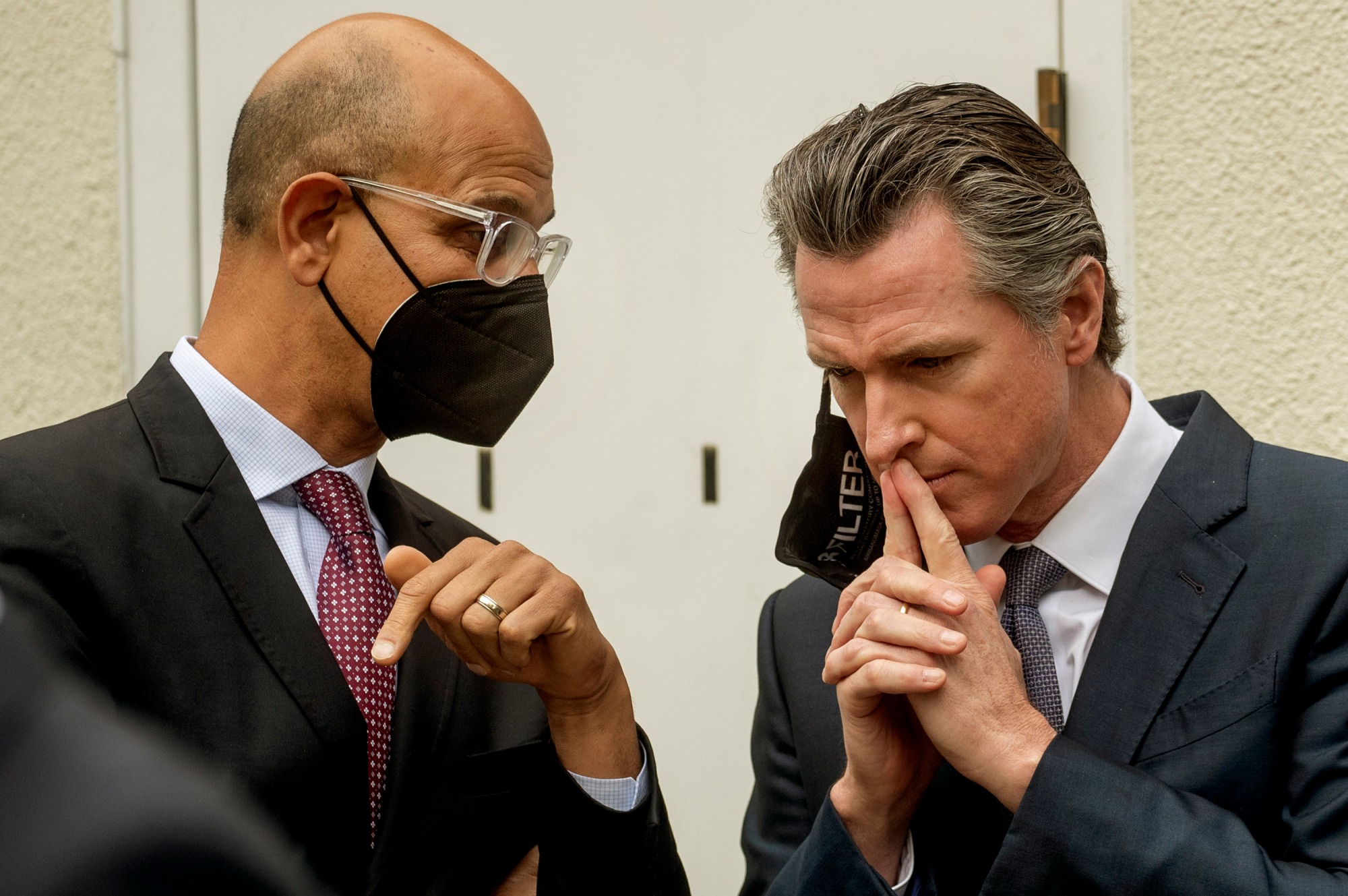 Gov. Gavin Newsom, right, confers with California Health & Human Services secretary Dr. Mark Ghaly before a media event on Thursday, March 3, 2022, in San Jose, Calif. (Photo: Karl Mondon/Bay Area News Group)